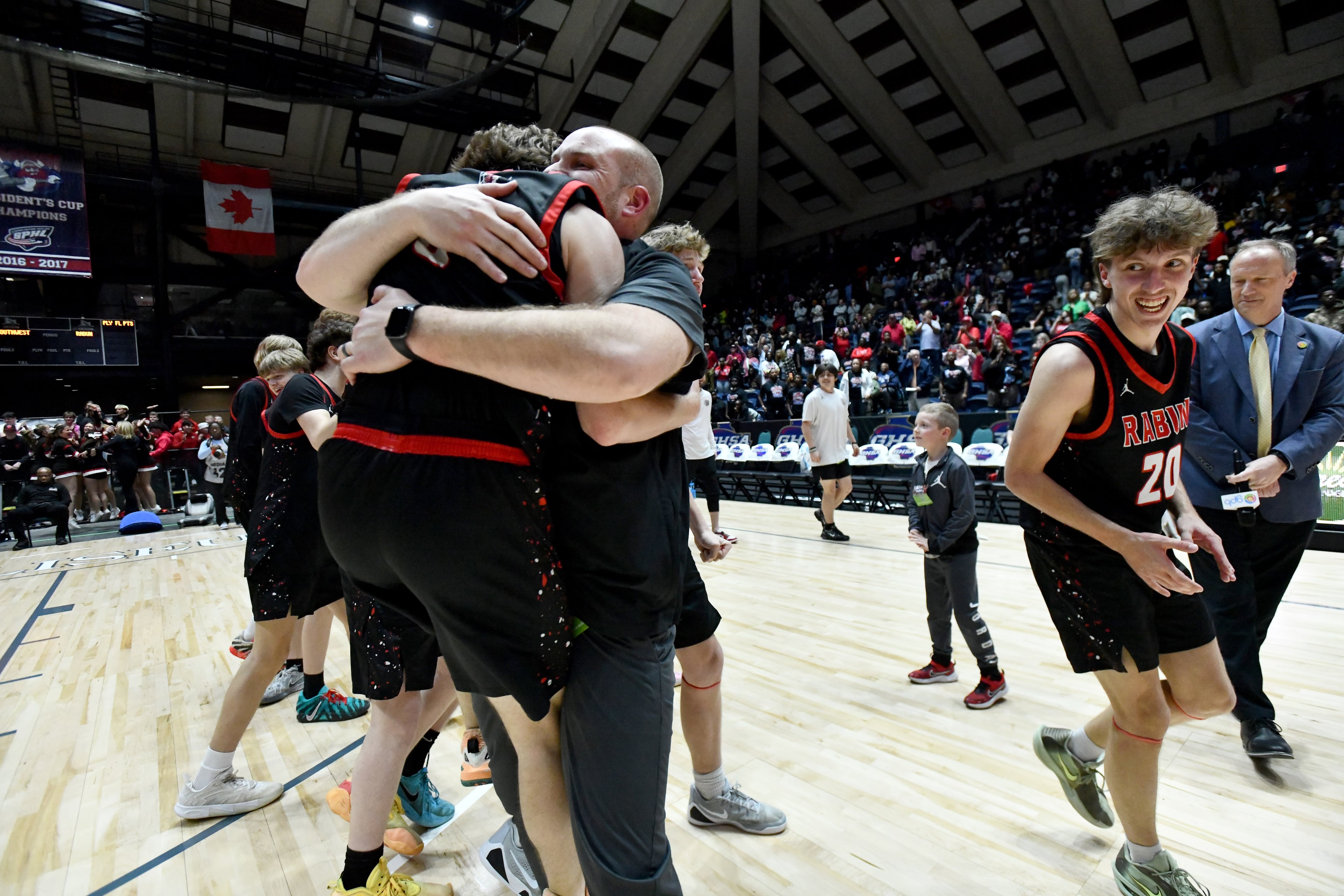 Rabun County players and coaching staff celebrate their win over Southwest during Class A Division I Boys GHSA State Championship at the Macon Coliseum, Friday, March 13, 2026, in Macon. Rabun County won 52-43 over Southwest. (Hyosub Shin/AJC)