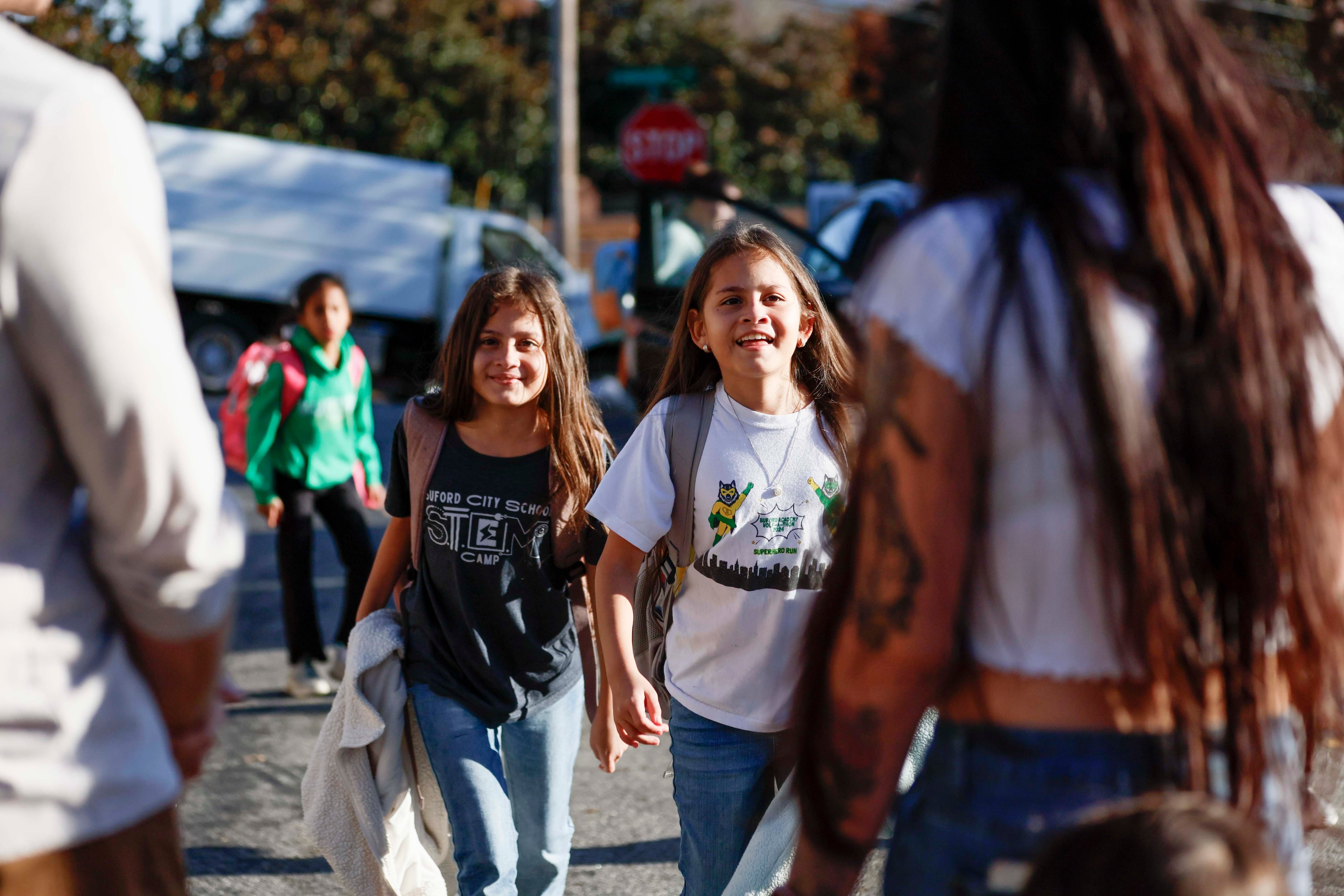 Ceudy Gutierrez greets her twin daughters, Maria Jose and Maria Camila, after they got off the school bus on Tuesday, Nov. 18, 2025. Ceudy Gutierrez is struggling to make ends meet for her and her three young children following her husband’s ICE arrest earlier this fall.
(Miguel Martinez/ AJC)
