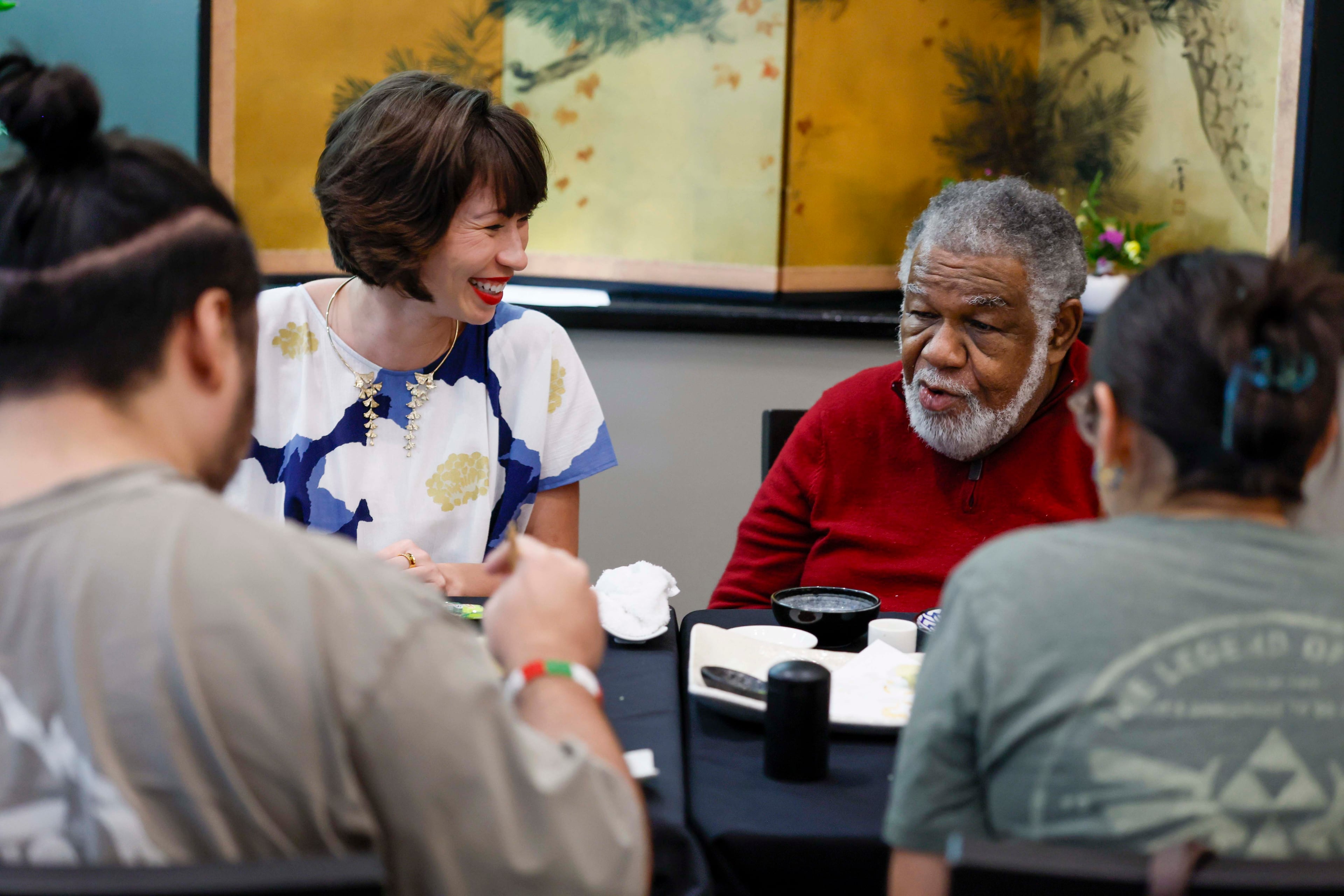 Freedom University Executive Director Laura Emiko Soltis speaks with board chair Charles A. Black at a celebratory dinner marking the conclusion of the virtual study abroad Japan program at Nakato restaurant in Atlanta on Sunday, Aug. 23, 2026. (Miguel Martinez/AJC)