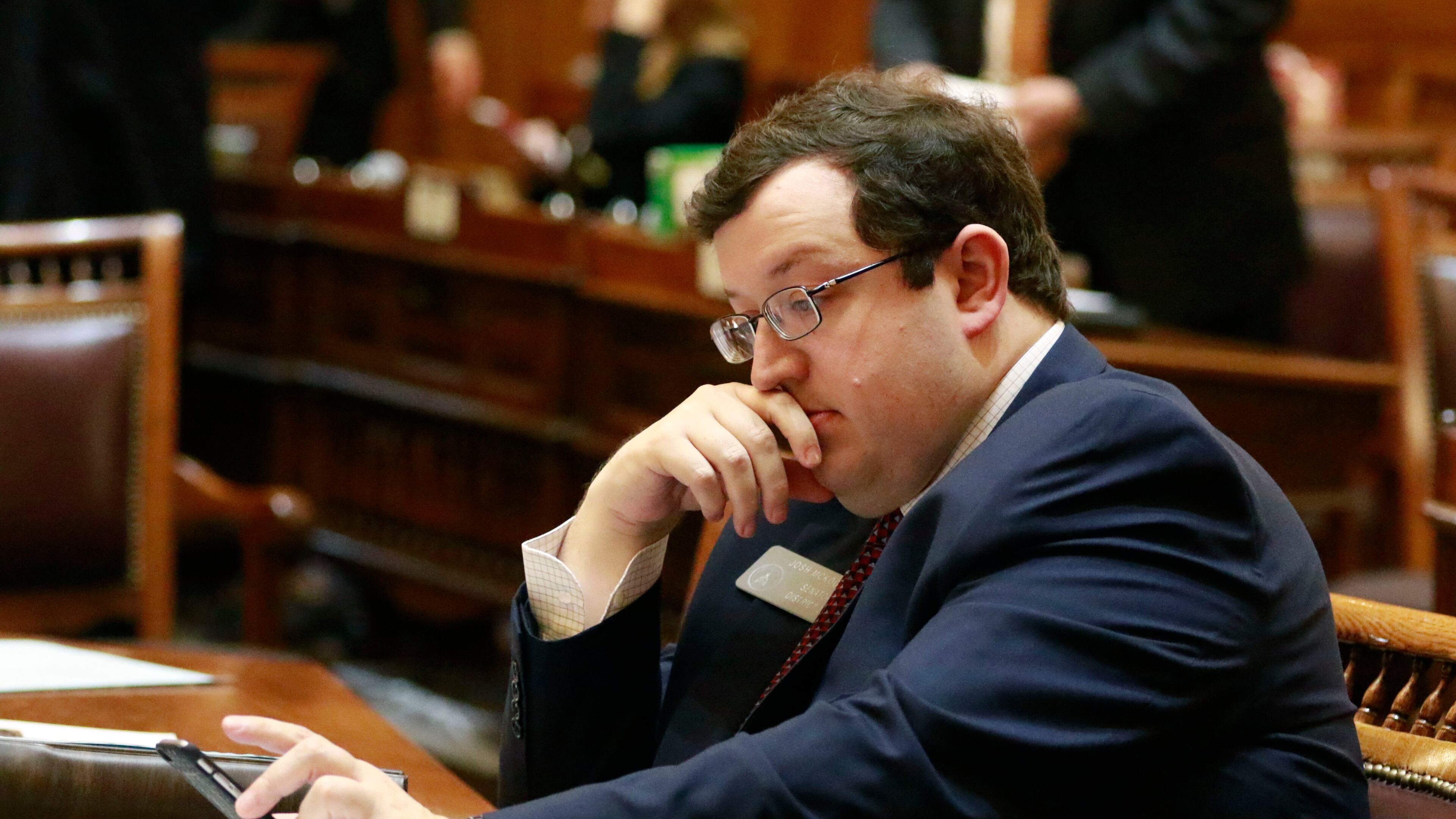 State Sen. Josh McKoon, R-Columbus, at his desk on the floor in 2016. Bob Andres, bandres@ajc.com