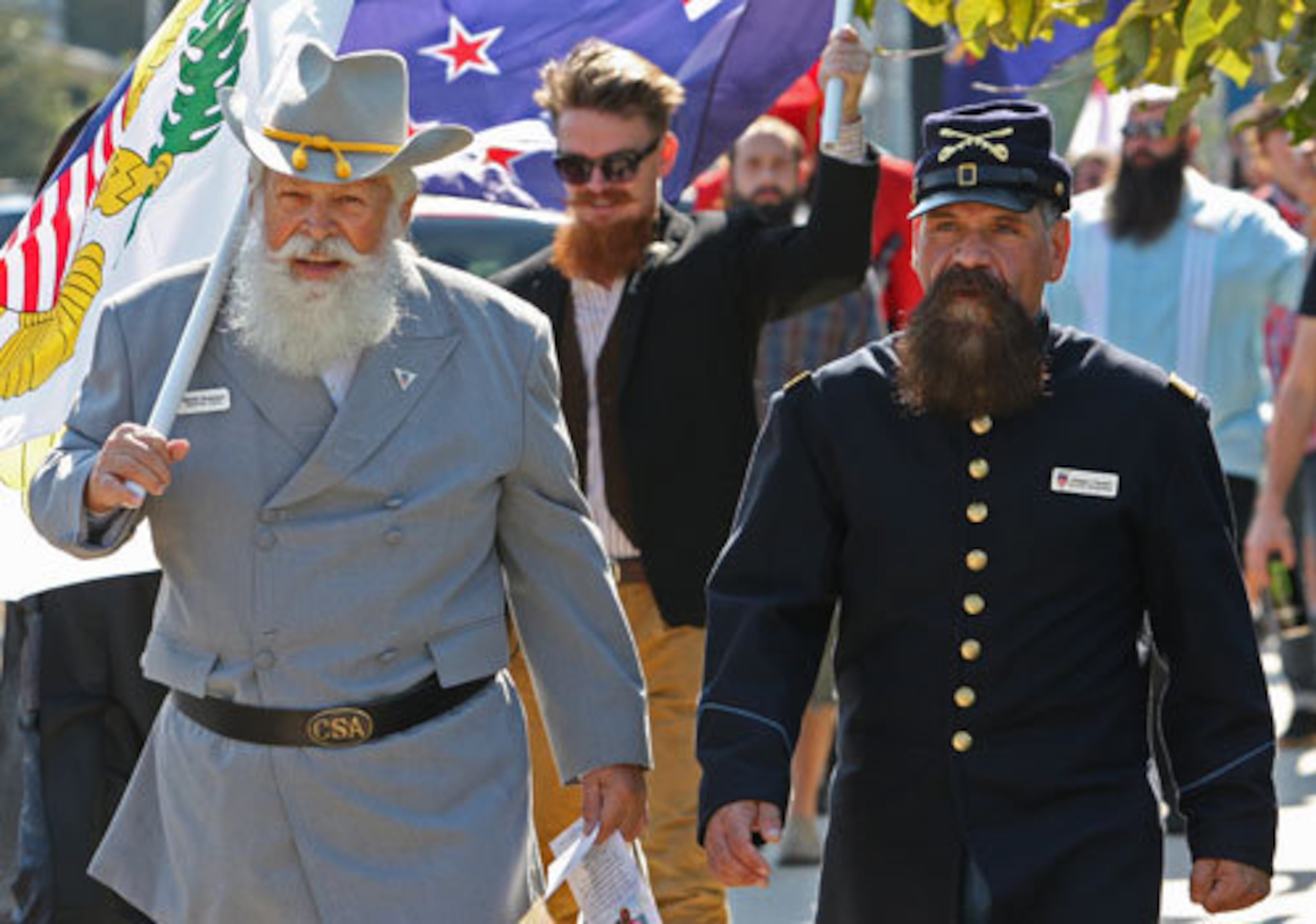 Rebel Dennis Dickerson, of Alexandria, Va., (left) marches with Yankee Joseph Fanelli, of Wyncote, Pa., in the Parade of Beards before the competition.