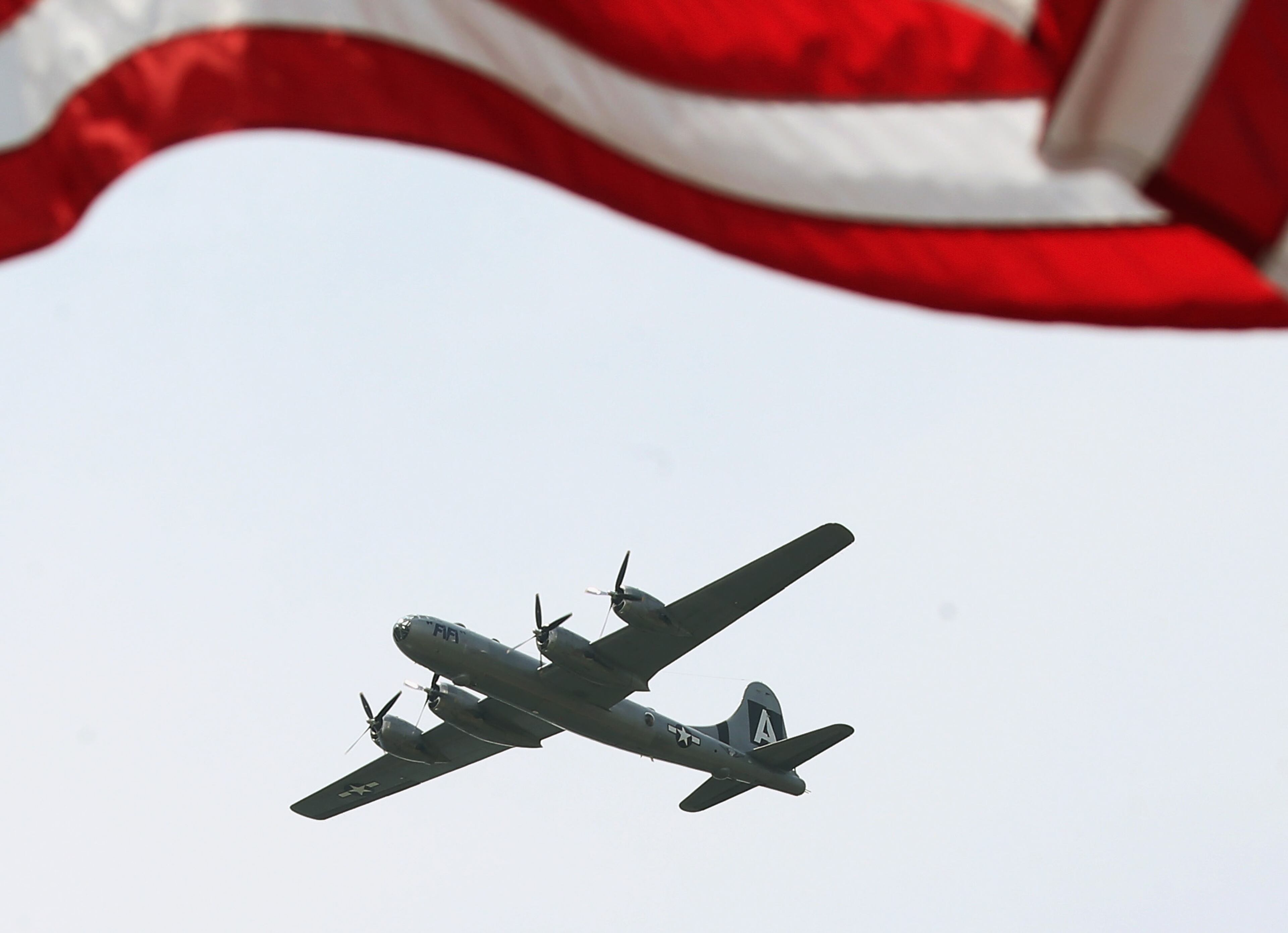 WASHINGTON, DC - MAY 08: A vintage World War II B29 bomber flies down the National Mall May 8, 2015 in Washington, DC. Fifty-six vintage war planes took part in a flyover near the WWII memorial for the 70th anniversary Victory in Europe celebration. (Photo by Mark Wilson/Getty Images)