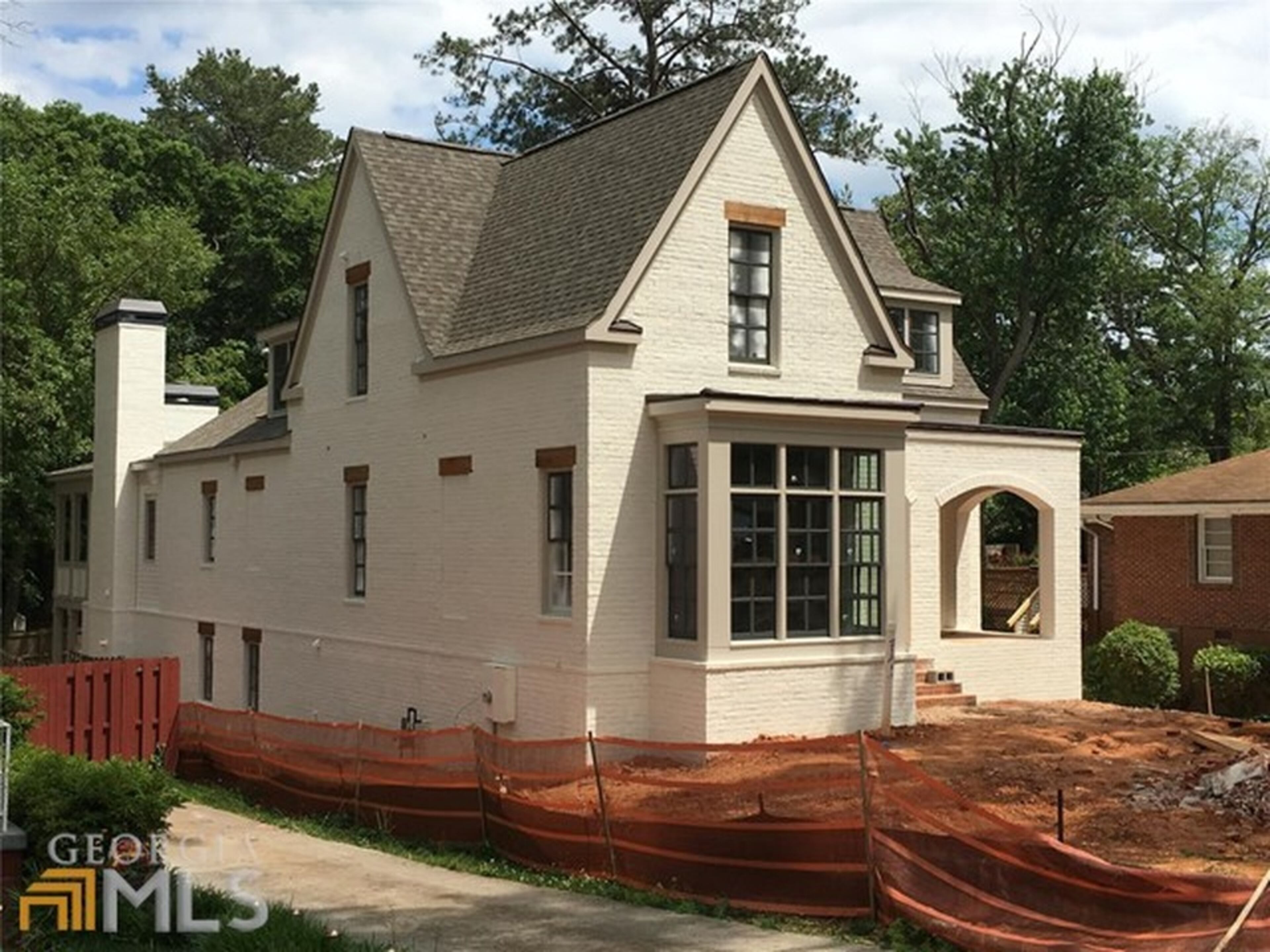 This 3,696 sqaure foot, all-brick Tudor house is not quite done, but features a a custom chef kitchen, five bedrooms, five baths anda kids' den on the upper level.
