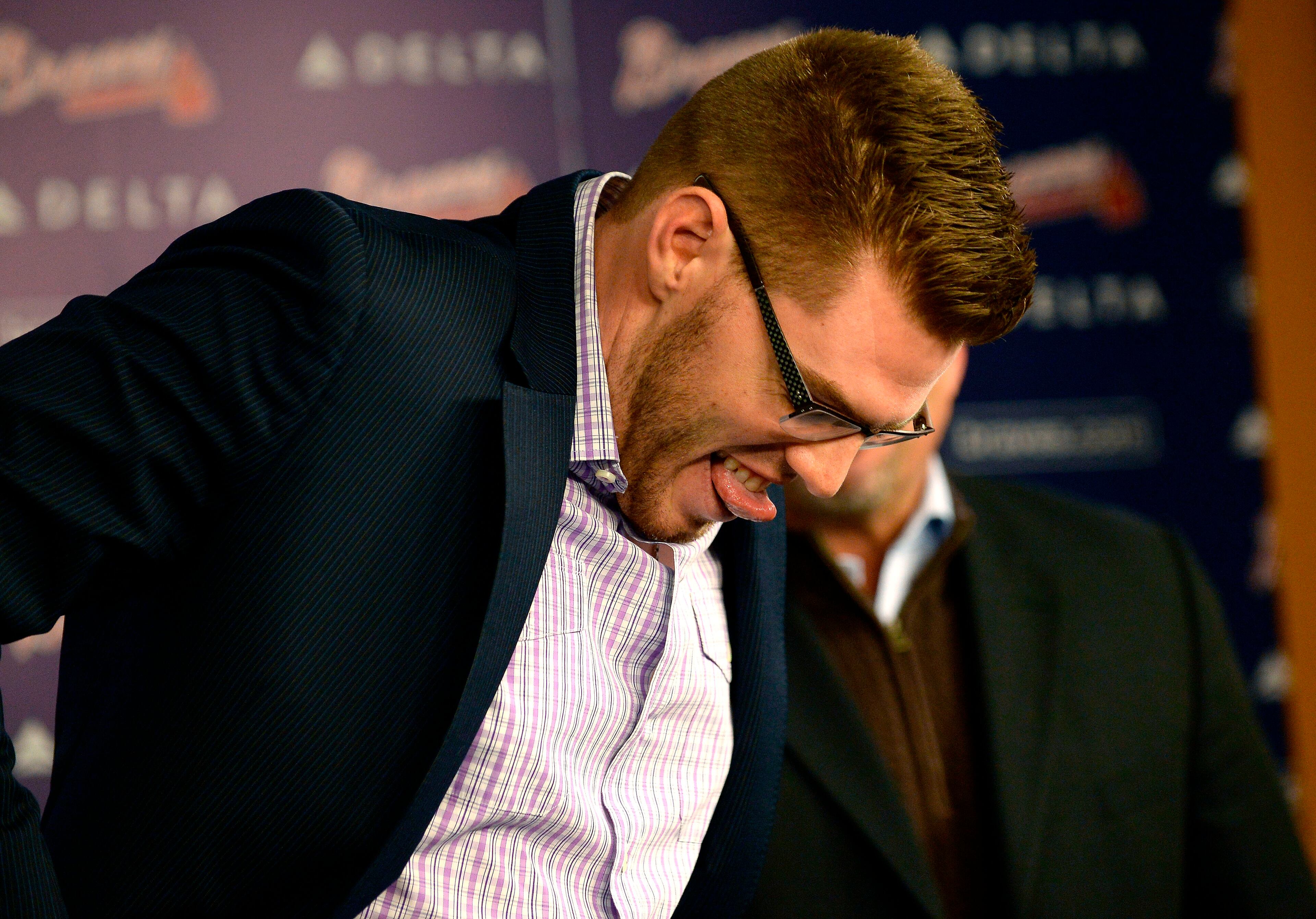 Atlanta Braves first baseman Freddie Freeman announces that he has agreed to terms with the team that will keep him in a Braves uniform for eight years, on Wednesday, Feb. 5, 2014, in Atlanta. Braves General Manager Frank Wren said, "Freddie has established himself as one of the best young talents in the game." David Tulis / AJC Special