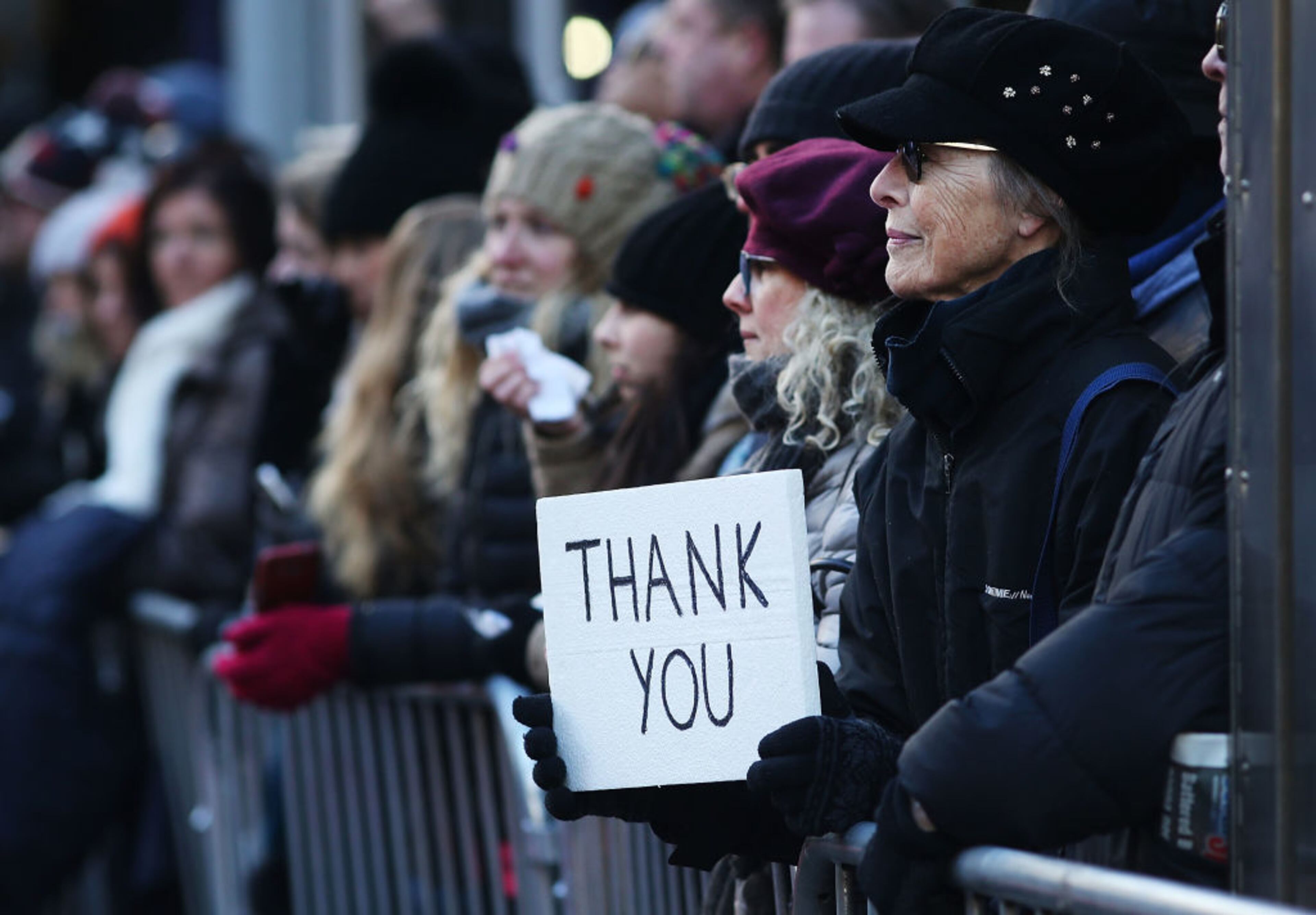 NEW YORK, NY - NOVEMBER 11: A woman holds a sign thanking veterans during the Veterans Day Parade on November 11, 2017 in New York City. The largest Veterans Day event in the nation, this year's parade features thousands of marchers, including military units, civic and youth groups, businesses and high school bands from across the country and veterans of all eras. The U.S. Air Force is this year's featured service and the grand marshal is space pioneer Buzz Aldrin. (Photo by Spencer Platt/Getty Images)