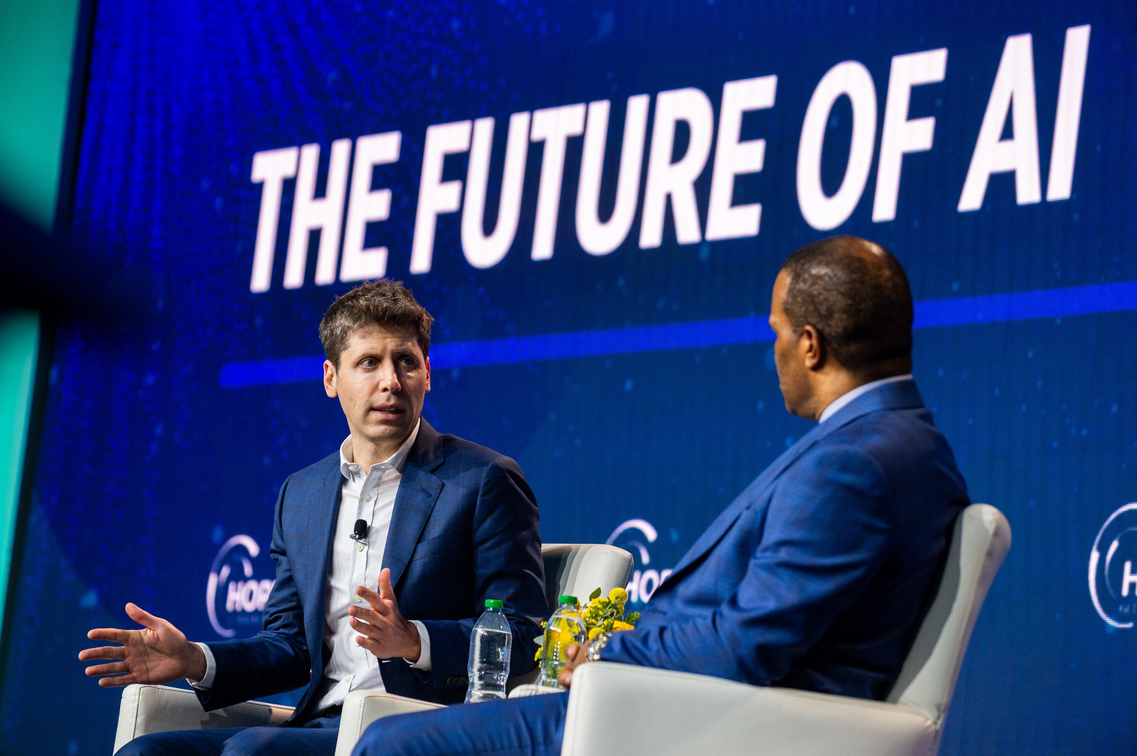 231211 ATLANTA, GA — From left, OpenAI CEO Sam Altman and founder and CEO of Operation HOPE John Hope Bryant speak at the HOPE Global Forums at the Hyatt Regency in downtown Atlanta on Monday, Dec. 11, 2023.
(Bita Honarvar for The Atlanta Journal-Constitution)