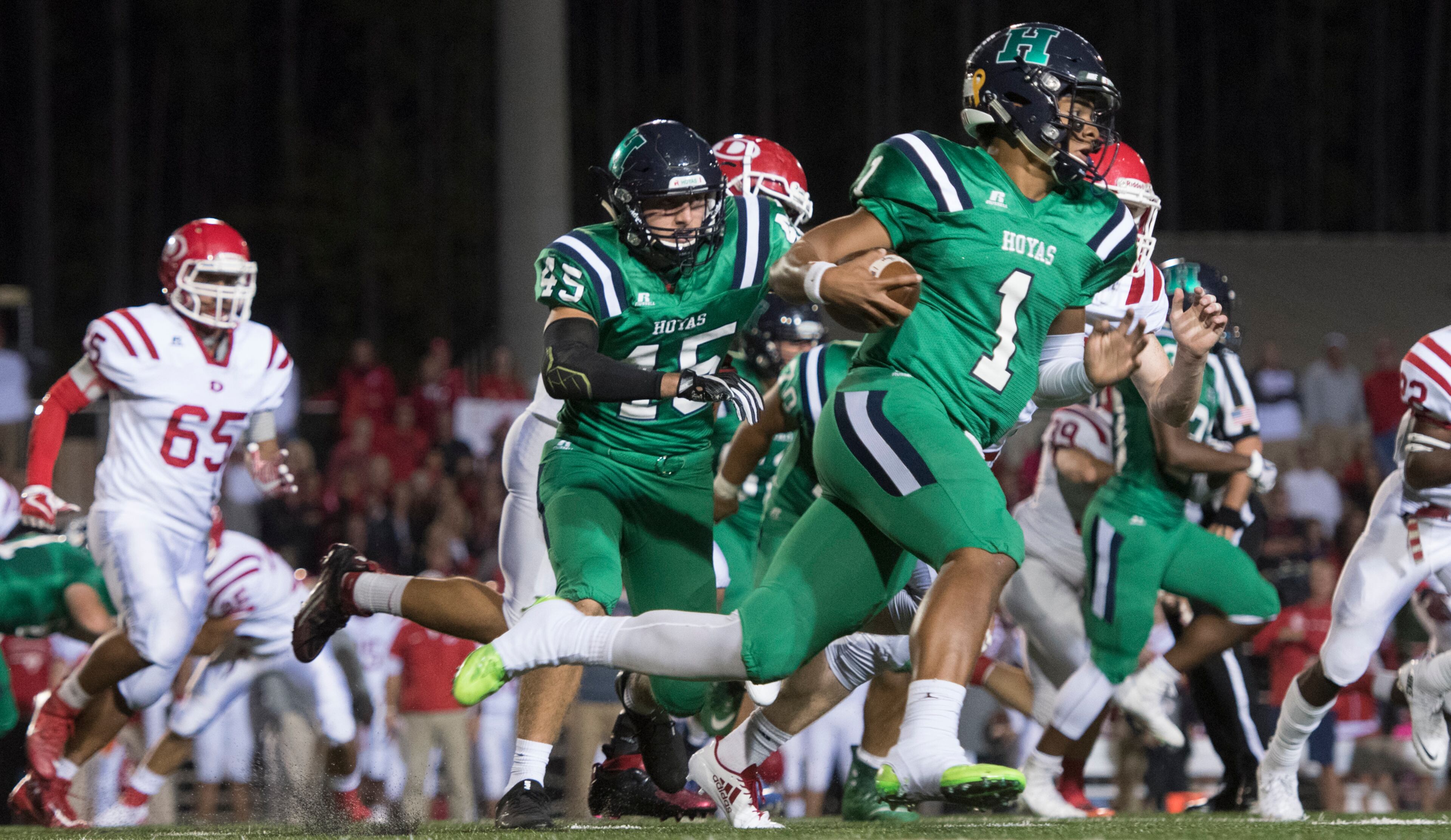 Harrison quarterback Justin Fields (1) runs against the defense of Dalton during a high school football game on Thursday, Oct. 19, 2017, in Kennesaw, Ga. (Special to the Atlanta Journal-Constitution, John Amis )