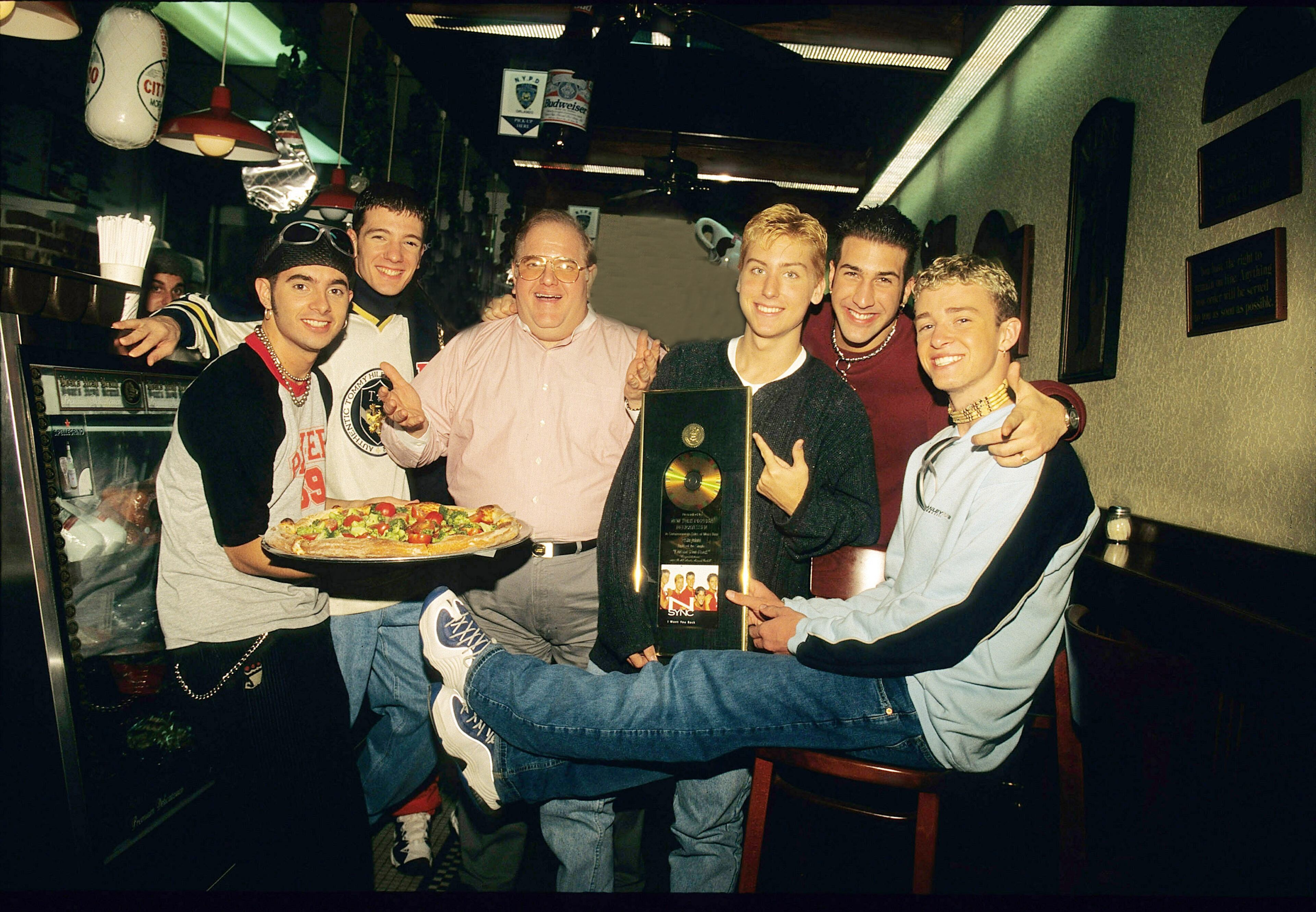 MIAMI - JUNE 06: Lou Pearlman poses with N'Sync Chris Kirkpatrick, JC Chasez, Lance Bass, Joey Fatone and Justin Timberlake seen at N.Y.P.D. pizza in Miami, circa 1996. (Photo by Mark Weiss/WireImage)