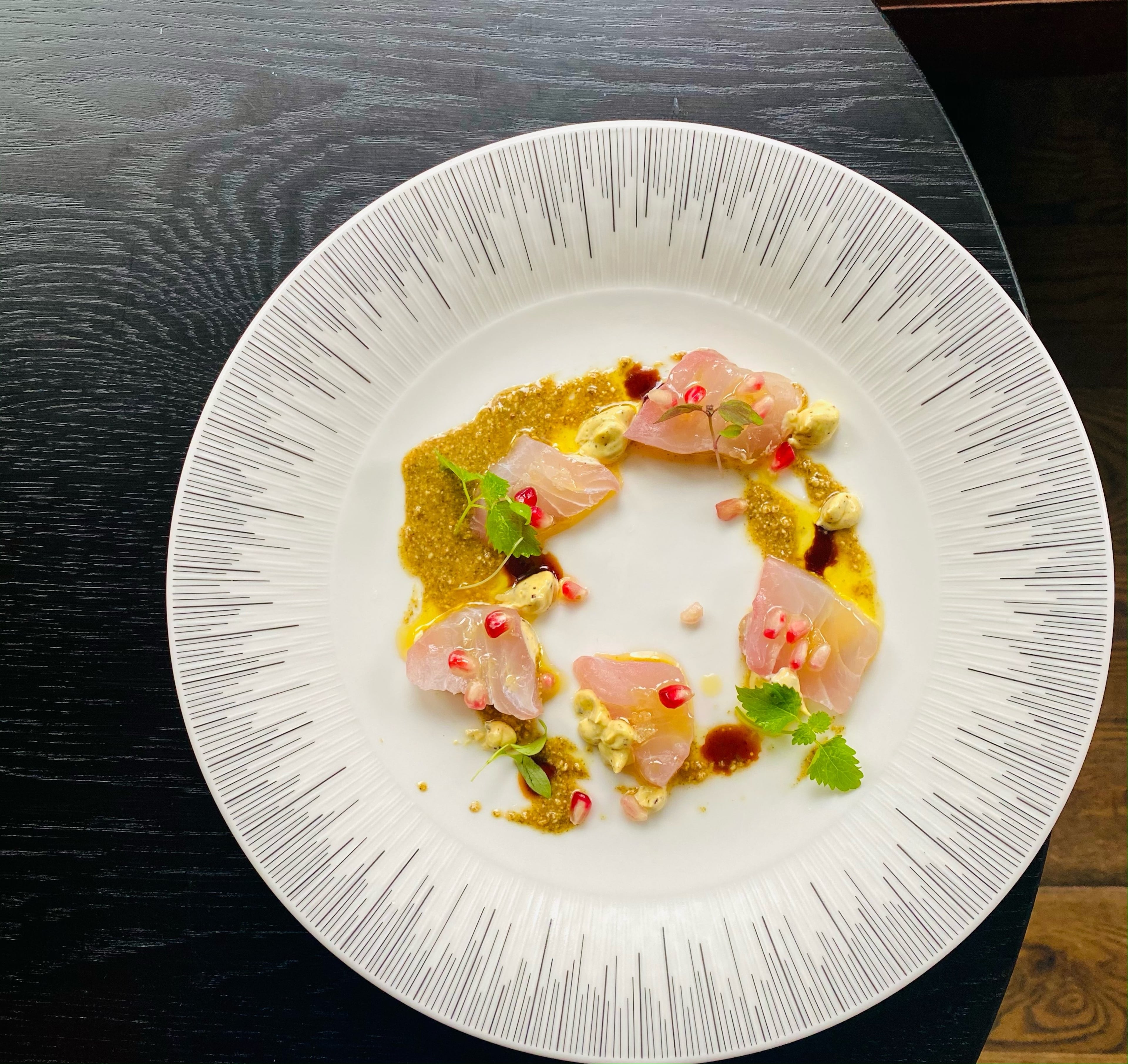Snapper crudo accompanied with pumpkin seed butter, pomegranate seeds and a dulse-aji amarillo aioli has been served at Lyla Lila. (Courtesy of Craig Richards)