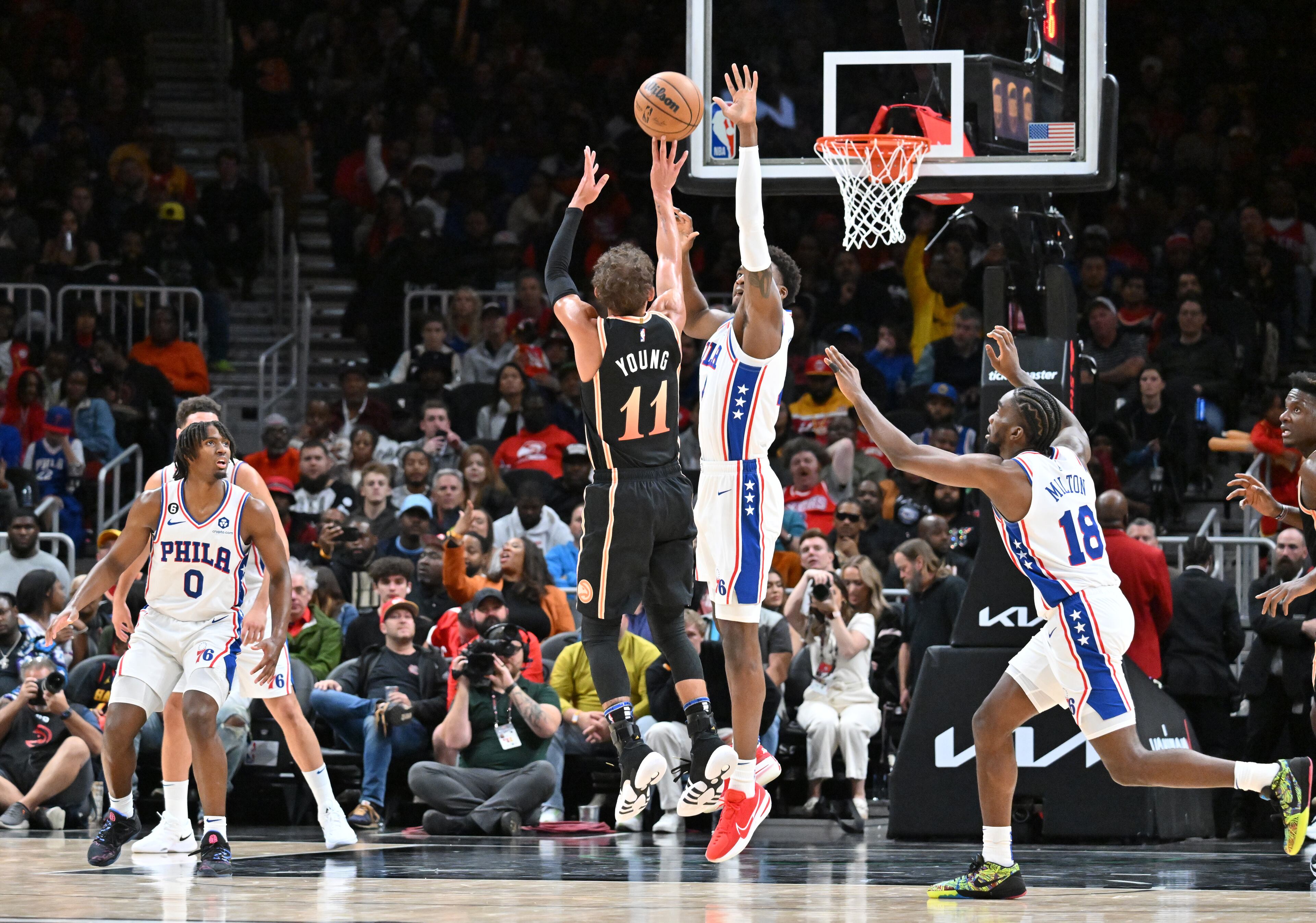 Hawks' guard Trae Young (11) shoots against Philadelphia 76ers' forward Paul Reed (44) during the second half. (Hyosub Shin / Hyosub.Shin@ajc.com)