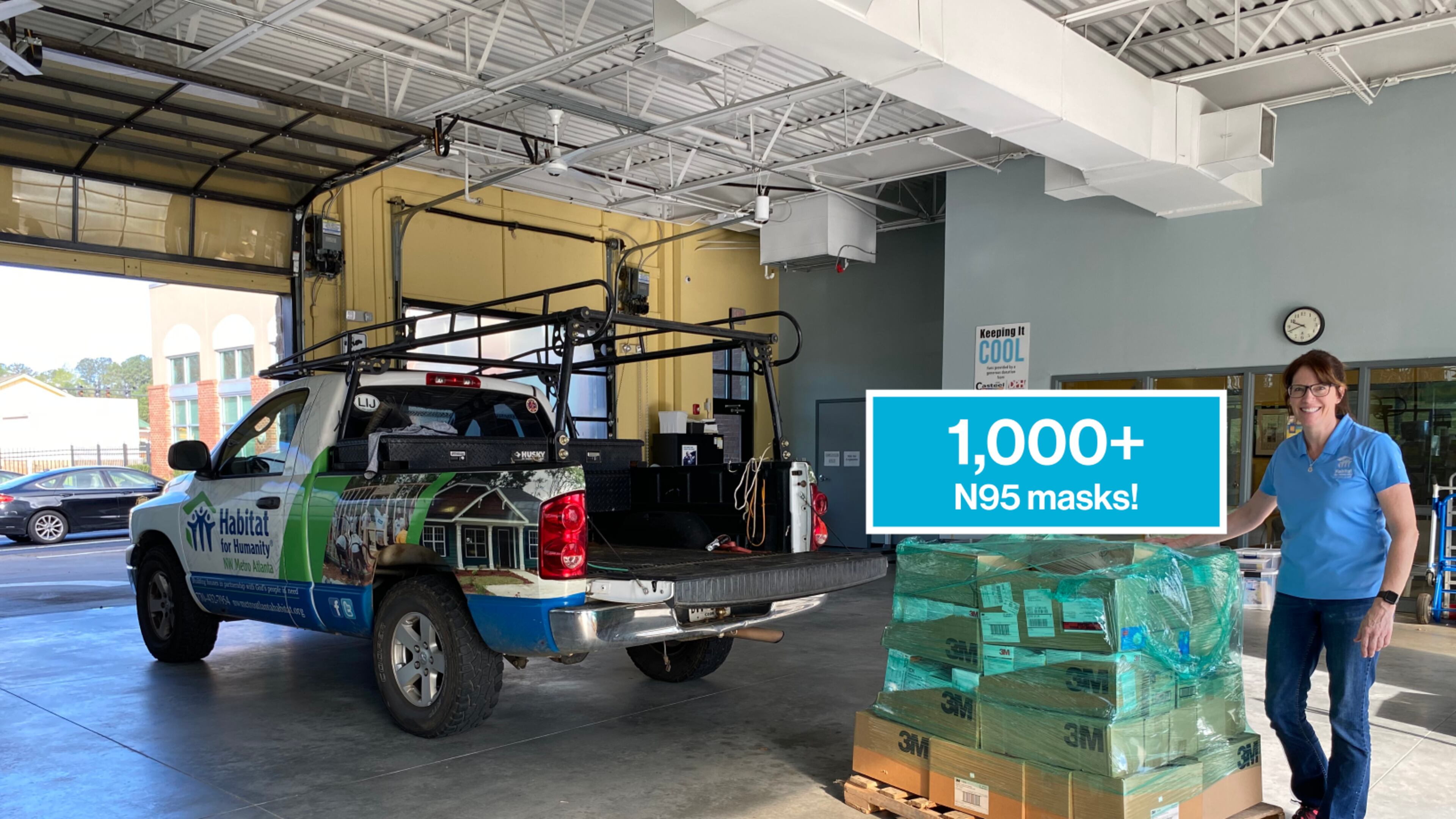 Bonnie Willis with the NW Metro Atlanta Habitat for Humanity stands beside the 1,000 N95 masks the organization donated to the Cobb & Douglas Public Health Department.