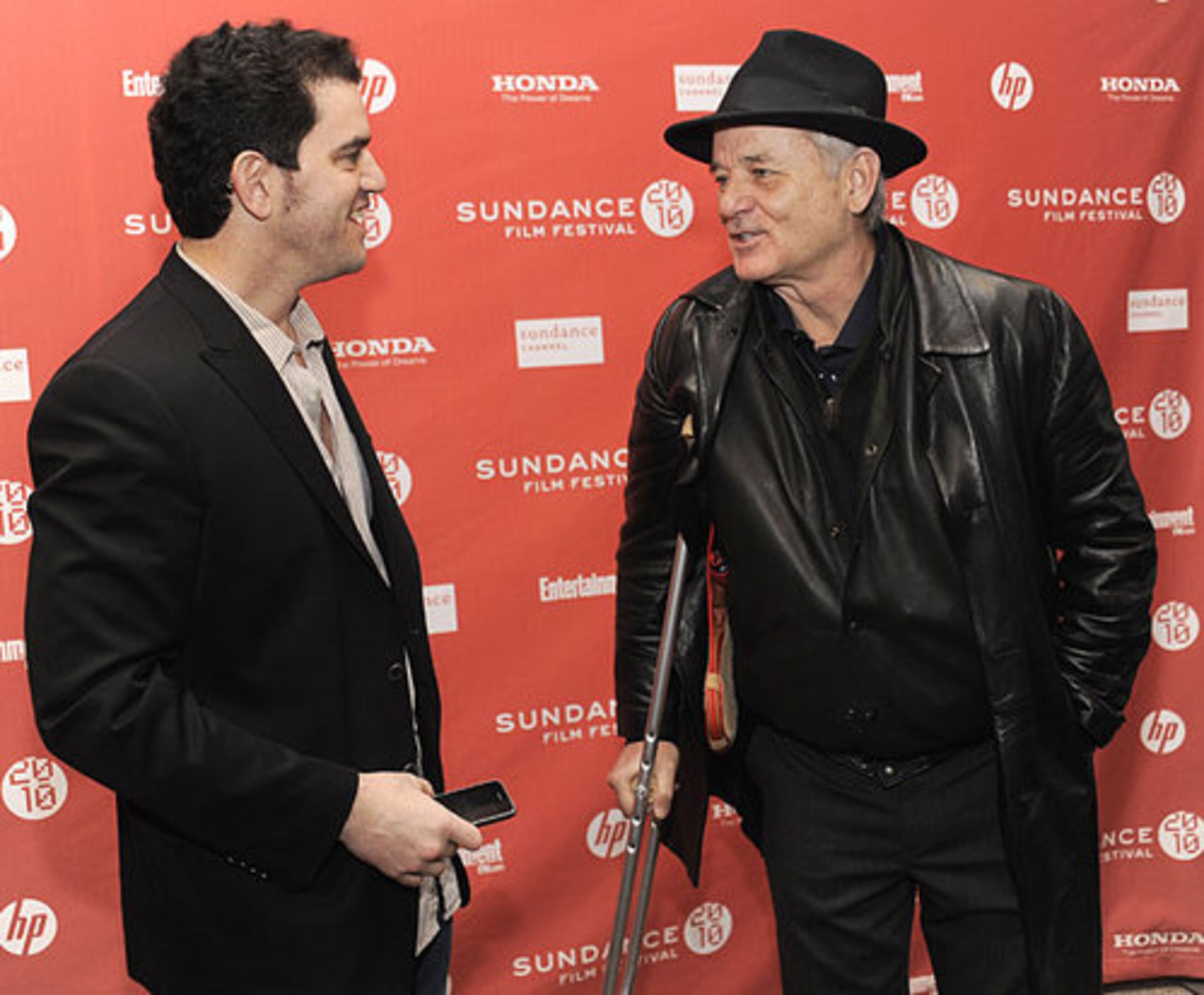 Aaron Schneider, left, director of "Get Low, " greets cast member Bill Murray at the premiere of the film. "Get Low," you may remember, was filmed here in Georgia.