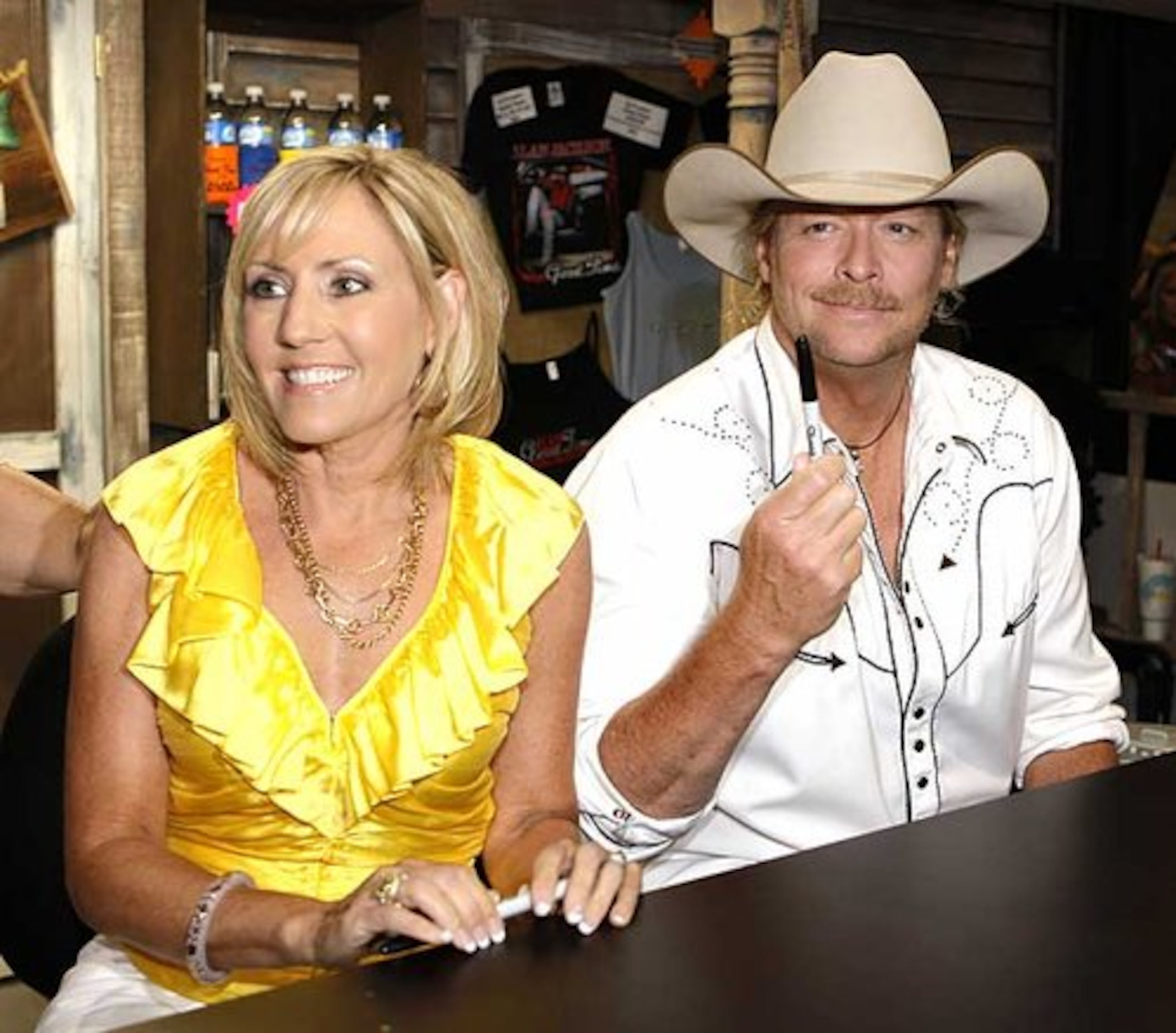 Newnan native Alan Jackson, right, and his wife, Denise Jackson, prepare to sign autographs at the Alan Jackson booth in the Nashville Convention Center, during the CMA Music Festival. Alan Jackson has a new album out, and Denise Jackson, a new book. The couple recently returned to Newnan for an autograph session.