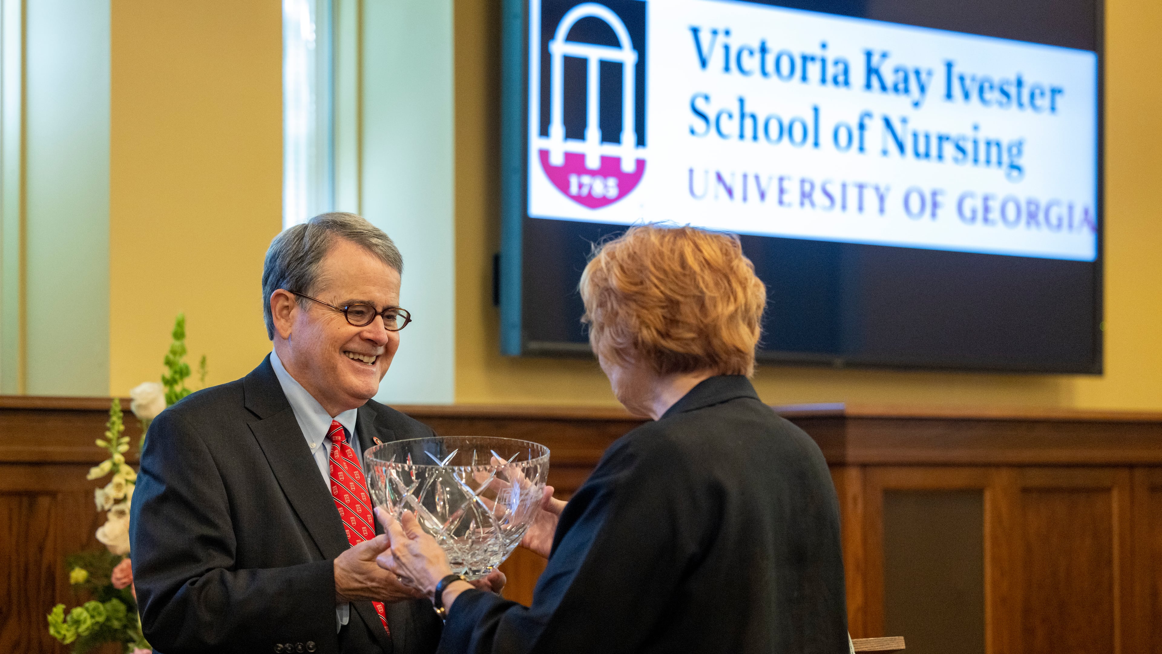 University of Georgia President Jere Morehead (left) honors Kay Ivester during an event Friday, April 17, 2026, where it was announced that UGA's new School of Nursing will be named after Ivester. (Courtesy of Dorothy Kozlowski/UGA)