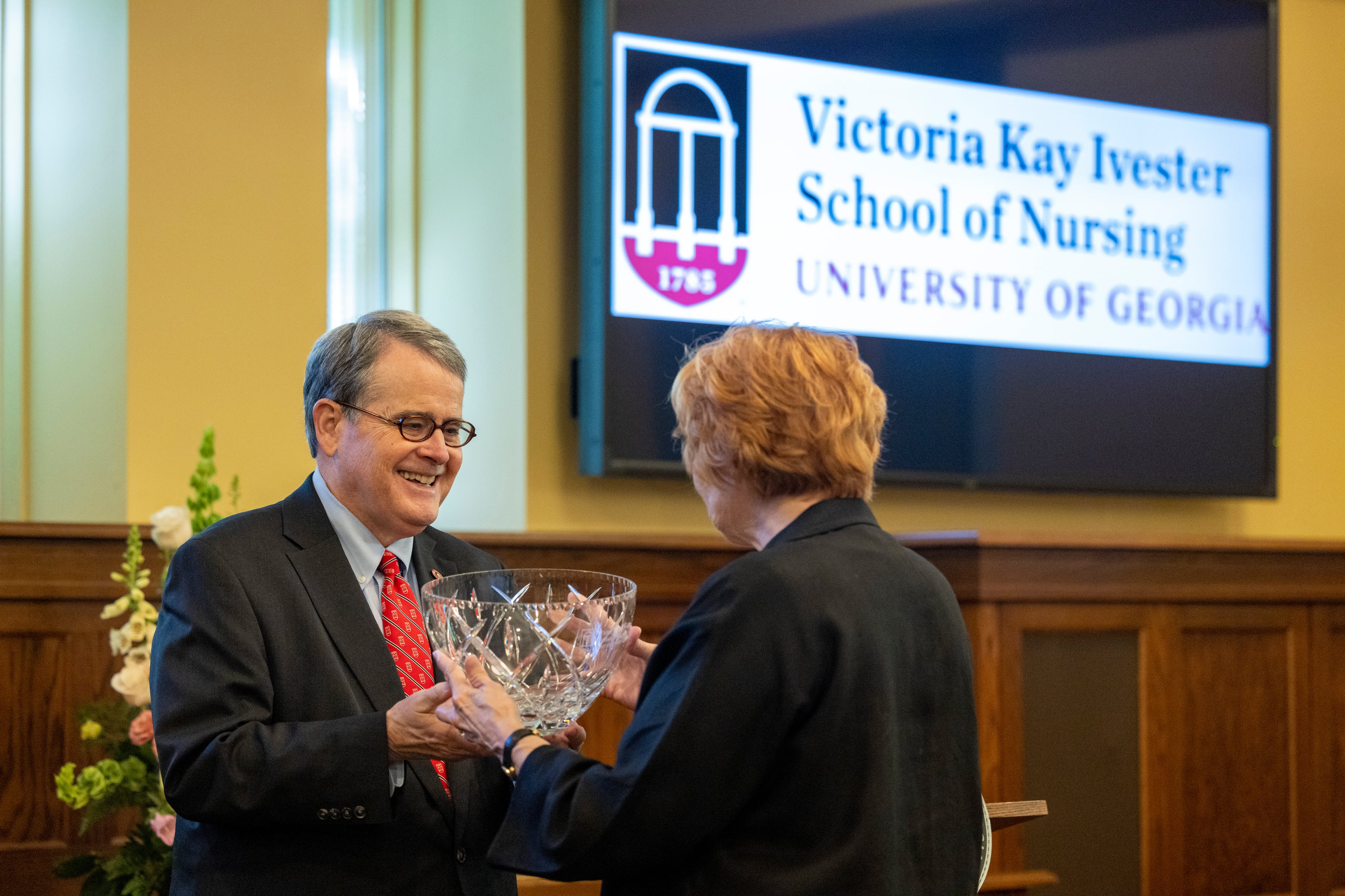 University of Georgia President Jere Morehead (left) honors Kay Ivester during an event Friday, April 17, 2026, where it was announced that UGA's new School of Nursing will be named after Ivester. (Courtesy of Dorothy Kozlowski/UGA)