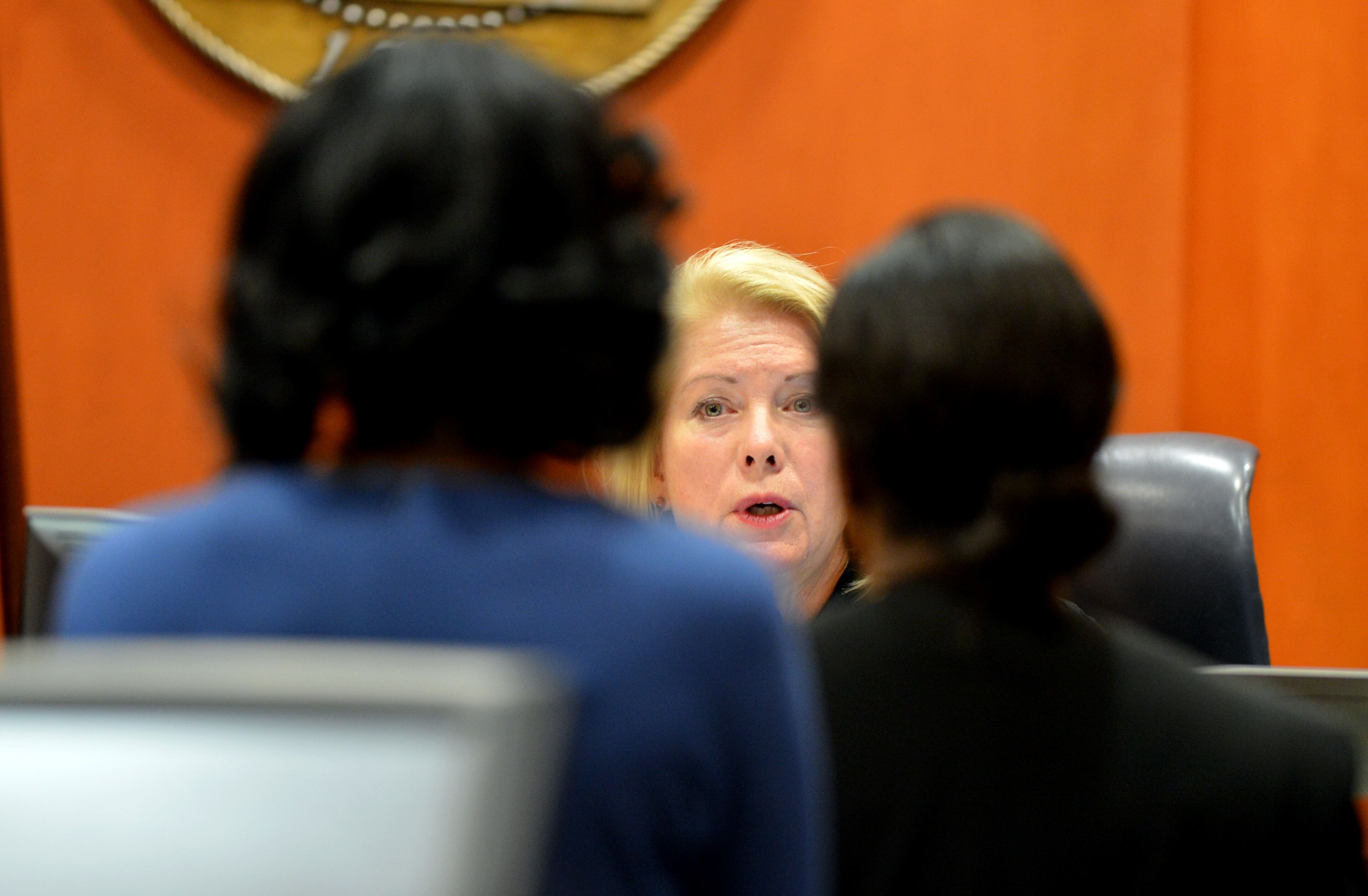 Judge Cynthia Becker talks with attorneys in the case Monday. Defendants Tony Pope, Pat Reid and Crawford Lewis were sentenced in the Dekalb schools corruption case before Superior Court Judge Cynthia Becker Monday, December 9, 2013. Pope, the former chief operating officer for DeKalb County schools was sentenced to 15 years in prison and her former husband, Tony Pope, was sentenced to eight years in prison for manipulating construction contracts that paid the husband $1.4 million for work he should not have received. was sentenced. Judge Becker rejected prosecutors' recommendation that former superintendent Crawford Lewis be sentenced to 12 months on probation for misdemeanor obstruction, saying he deserved to be jailed. KENT D. JOHNSON / KDJOHNSON@AJC.COM