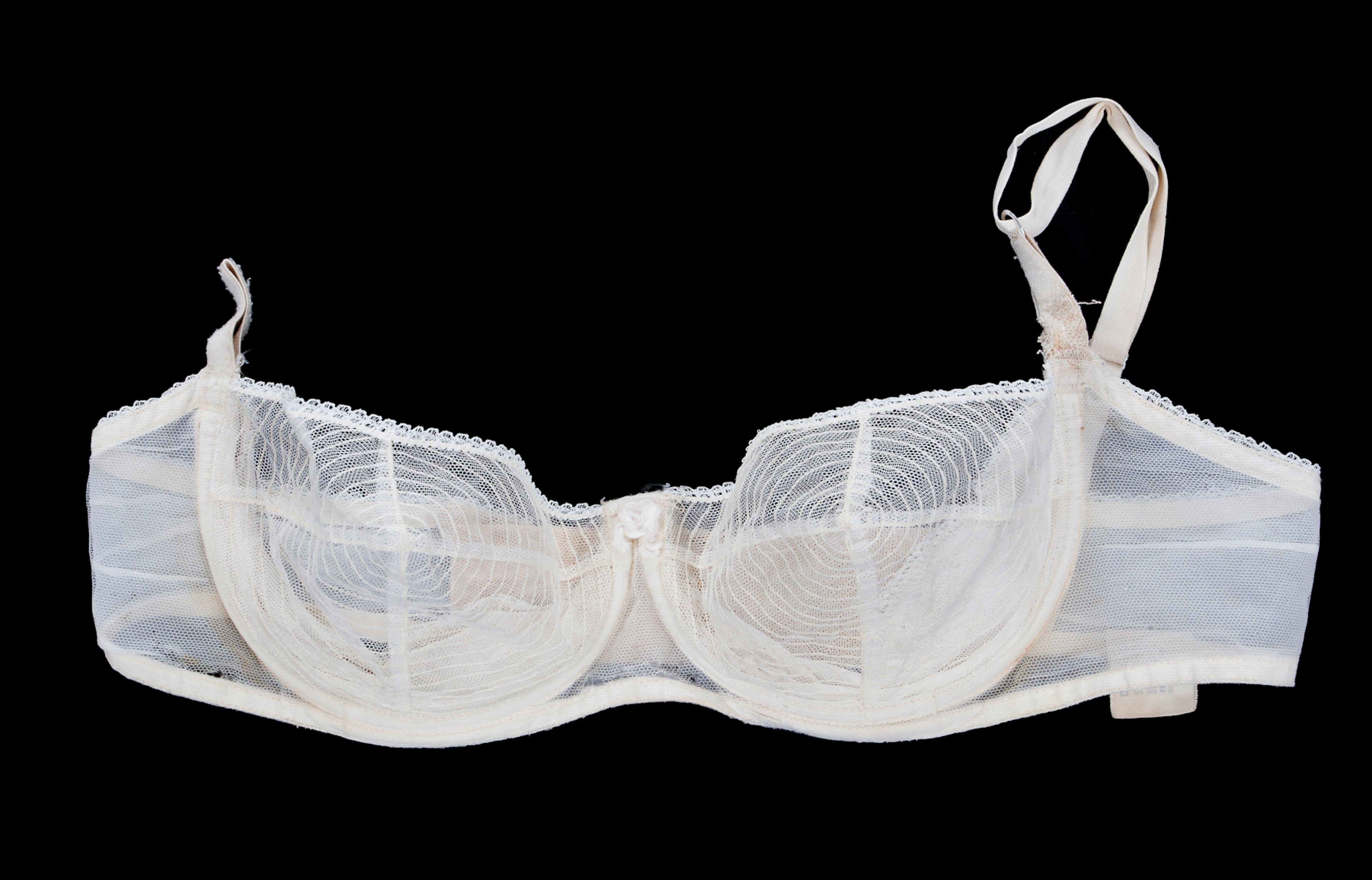 This photo provided by Julien's Auctions shows a nude-colored underwire brassiere with mesh-lined cups worn by actress Marilyn Monroe as part of her professional wardrobe. Marilyn Monroe's Lost Archives are coming to light now, along with a cache of other Monroe memorabilia that the Beverly Hills auction house Julien's is putting up for sale on Dec. 5-6, 2014. Along with the letters from DiMaggio, Miller and such Hollywood luminaries as Cary Grant and Jane Russell are some of the actress' favorite clothes, photographs, paintings and other keepsakes. (AP Photo/Julien's Auctions)