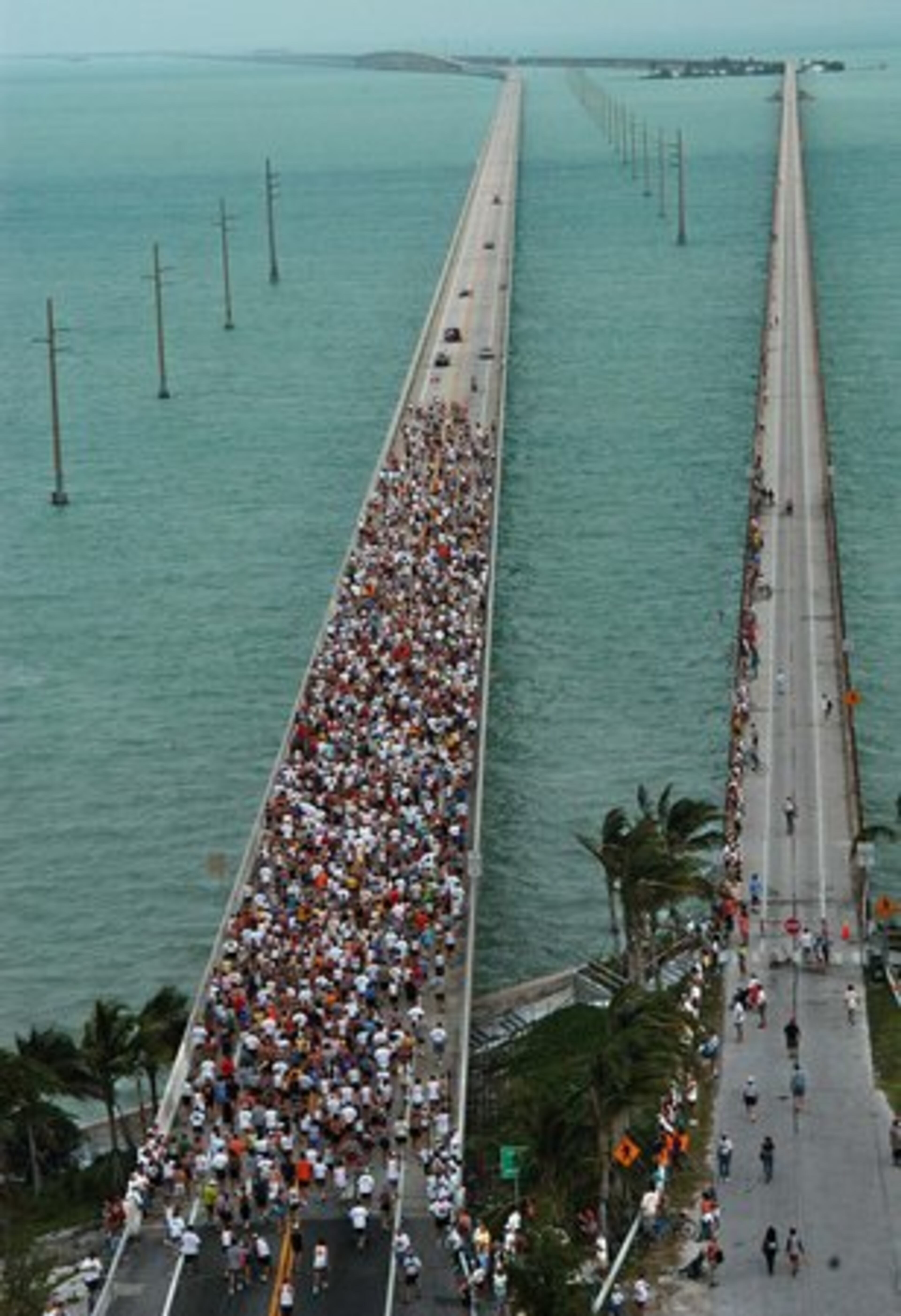 Overseas Highway, Florida: From Key Largo, near Miami, a series of bridges and causeways means you're driving over beautiful blue waters for more than a hundred miles, until the end of the road in Key West, the southernmost point in the continental U.S.