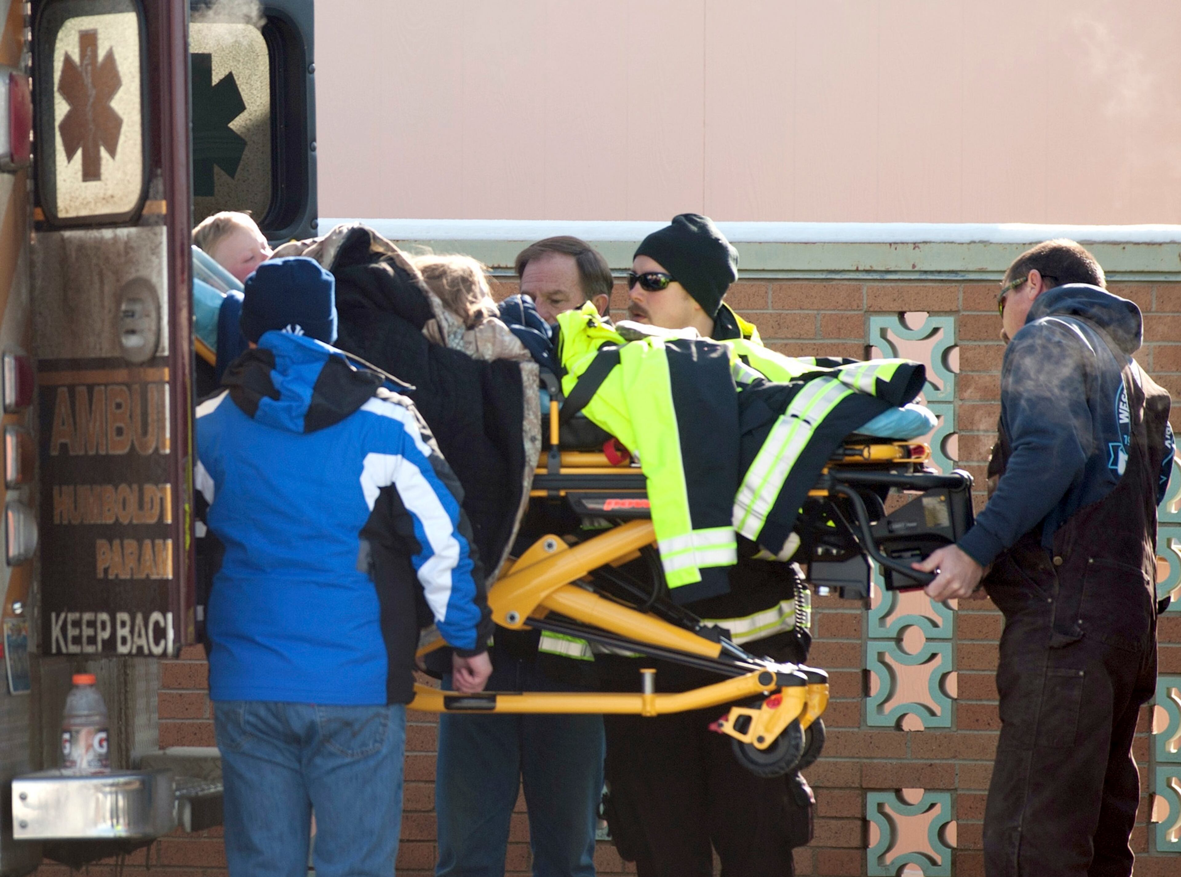 Members of a family that went missing are wheeled by stretcher from an ambulance into the Pershing General Hospital in Lovelock, Nevada, December 10, 2013. A Nevada couple and four young children reported missing on Sunday in a remote mountain range northeast of Reno were found safe by rescue workers on Tuesday huddled in a canyon, a dispatch supervisor for the Pershing County Sheriff's Office said. REUTERS/James Glover