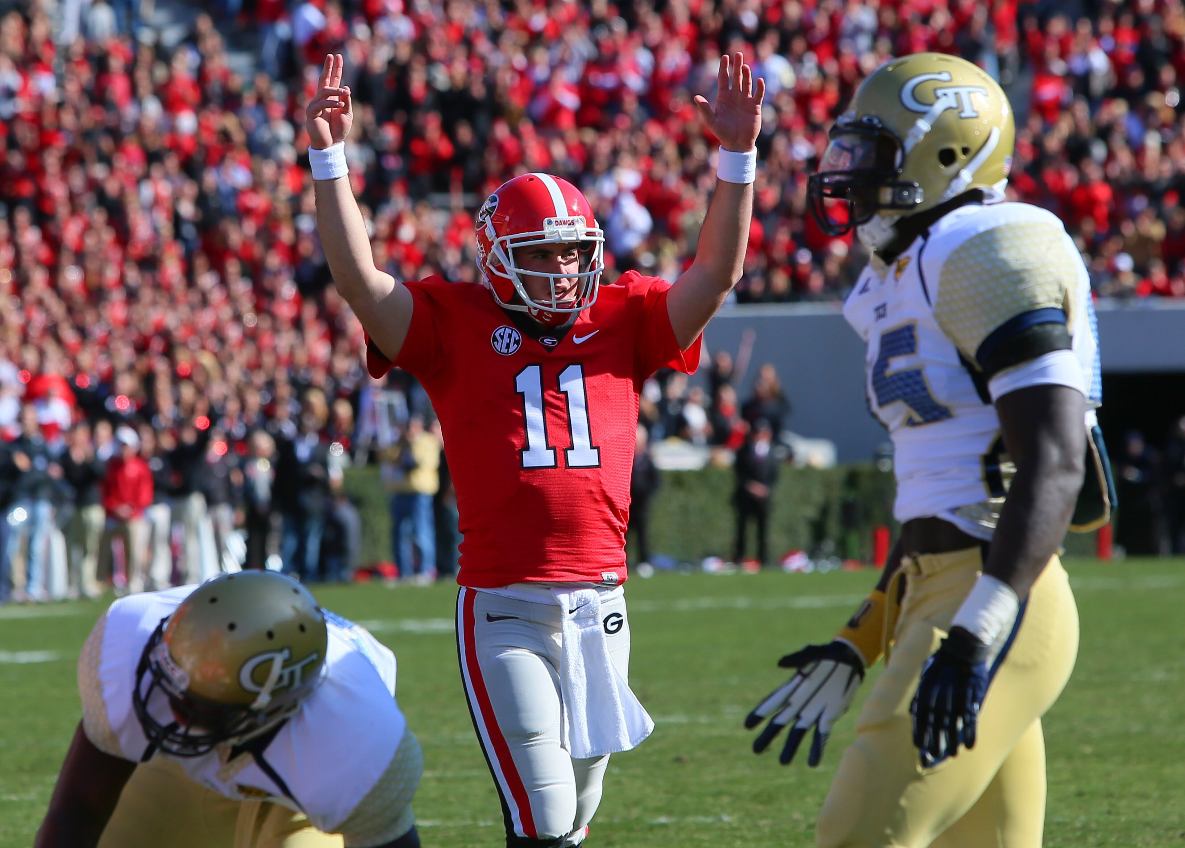 Georgia Bulldogs quarterback Aaron Murray (11) reacts to a Todd Gurley touchdown over Georgia Tech in the first quarter.
