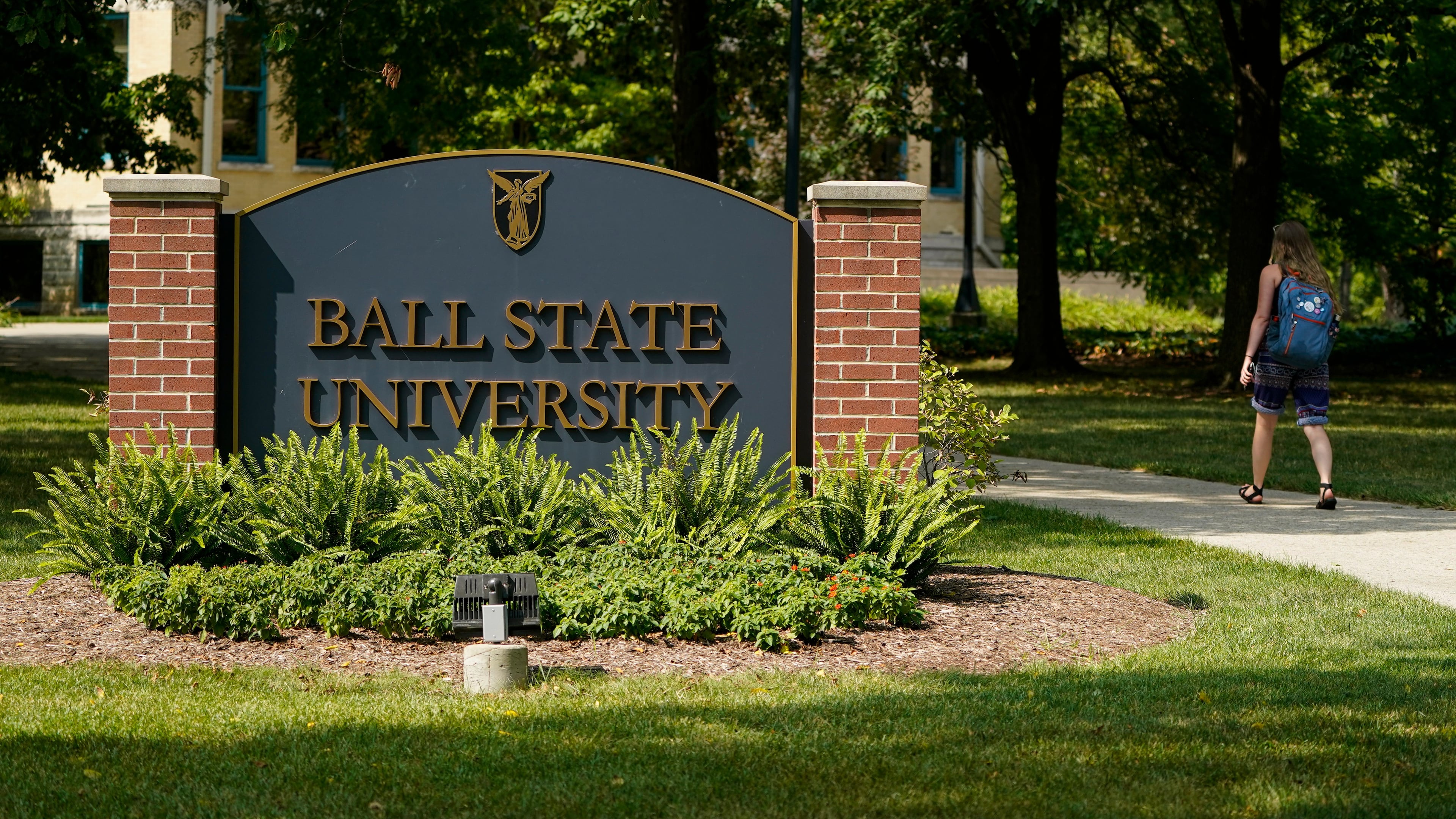 FILE - A student enters Ball State University campus in Muncie, Ind., Sept. 10, 2020. (AP Photo/Michael Conroy, File)