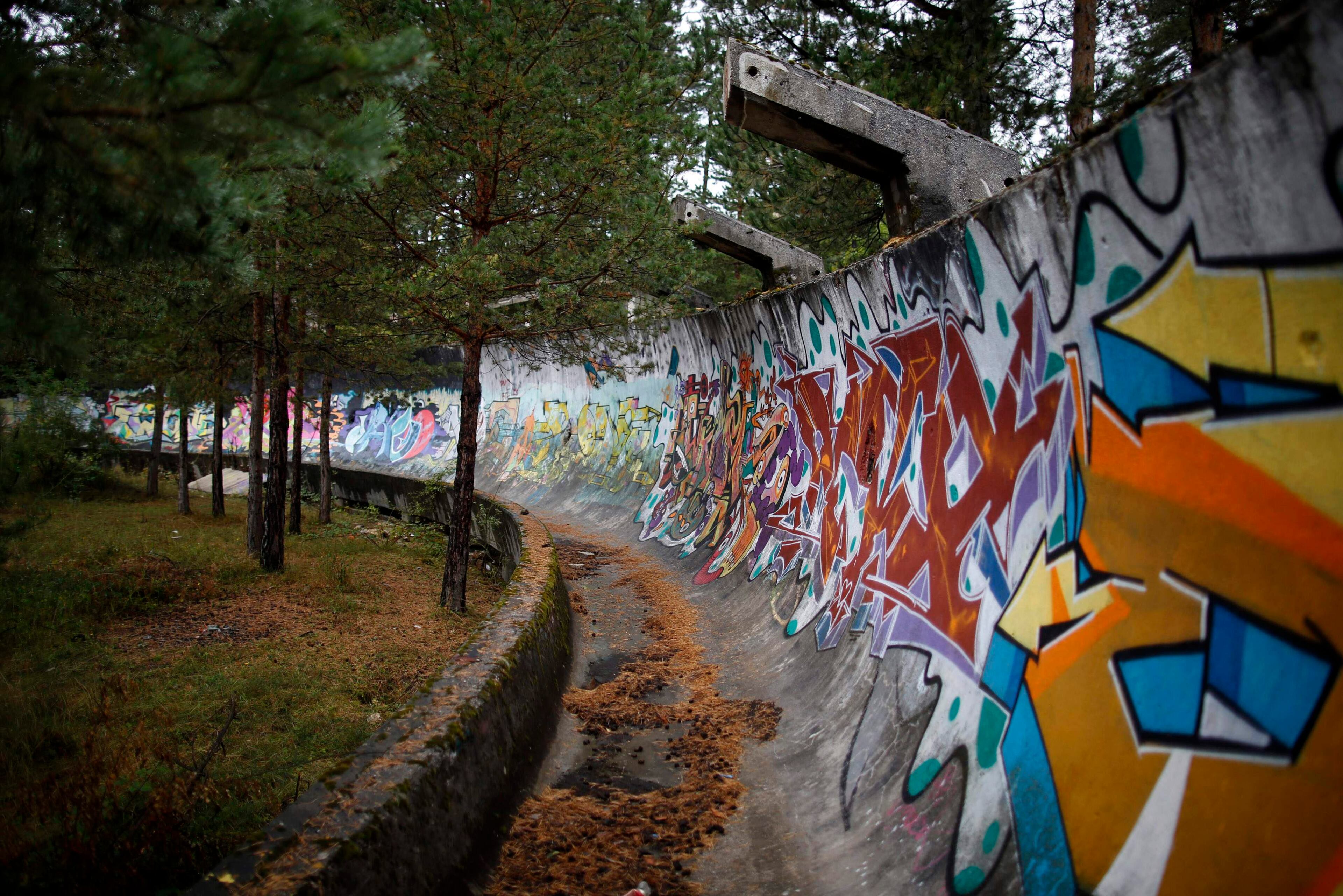 The disused bobsleigh track from the Sarajevo 1984 Winter Olympics is seen on Mount Trebevic, near Saravejo September 19, 2013. Abandoned and left to crumble into oblivion, most of the 1984 Winter Olympic venues in Bosnia's capital Sarajavo have been reduced to rubble by neglect as much as the 1990s conflict that tore apart the former Yugoslavia. The bobsleigh and luge track at Mount Trebevic, the Mount Igman ski jumping course and accompanying objects are now decomposing into obscurity. The bobsleigh and luge track, which was also used for World Cup competitions after the Olympics, became a Bosnian-Serb artillery stronghold during the war and is nowadays a target of frequent vandalism. The clock is now ticking towards the 2014 Winter Olympics, with October 29 marking 100 days to the opening of the Games in the Russian city of Sochi. Picture taken on September 19, 2013. REUTERS/Dado Ruvic
