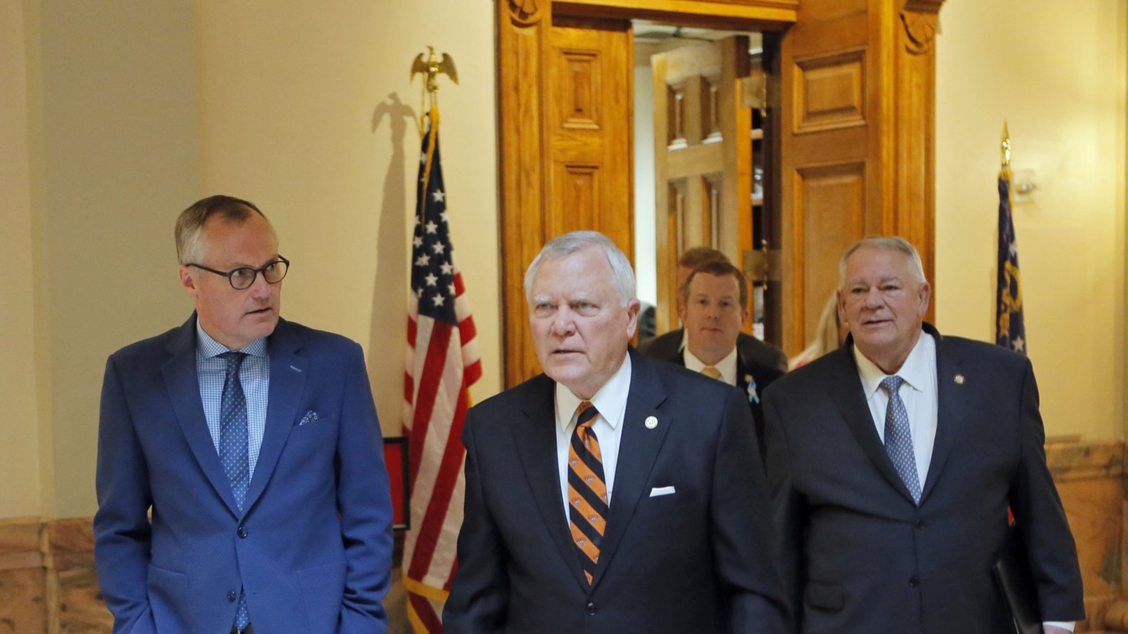 3/5/18 - Atlanta - Gov. Nathan Deal, Lt. Gov. Casey Cagle, House Speaker David Ralston and Rep. Bert Reeves head to a ceremony where Gov. Nathan Deal signed the adoption bill Reeves authored. BOB ANDRES /BANDRES@AJC.COM