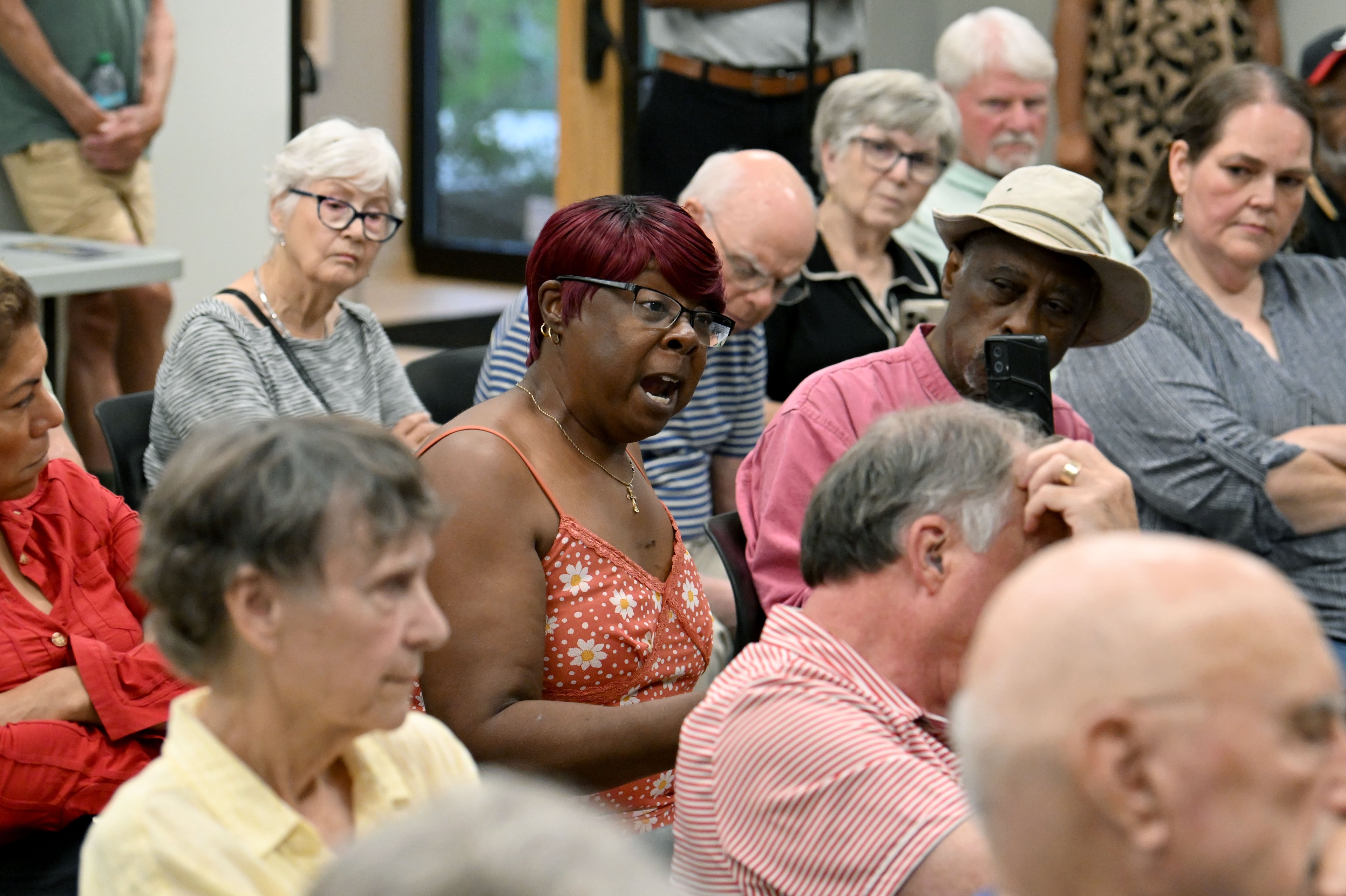 Barbara Daniel questions Georgia House Democratic representatives during a community conversation on taxes at the Bogart Library on Tuesday, Aug. 11, 2026, in Bogart, Ga. The Republican-led General Assembly is fixated on cutting income and property taxes. Meanwhile, a group of Democrats is touring the state to promote an alternative vision of government funding. (Hyosub Shin/AJC)