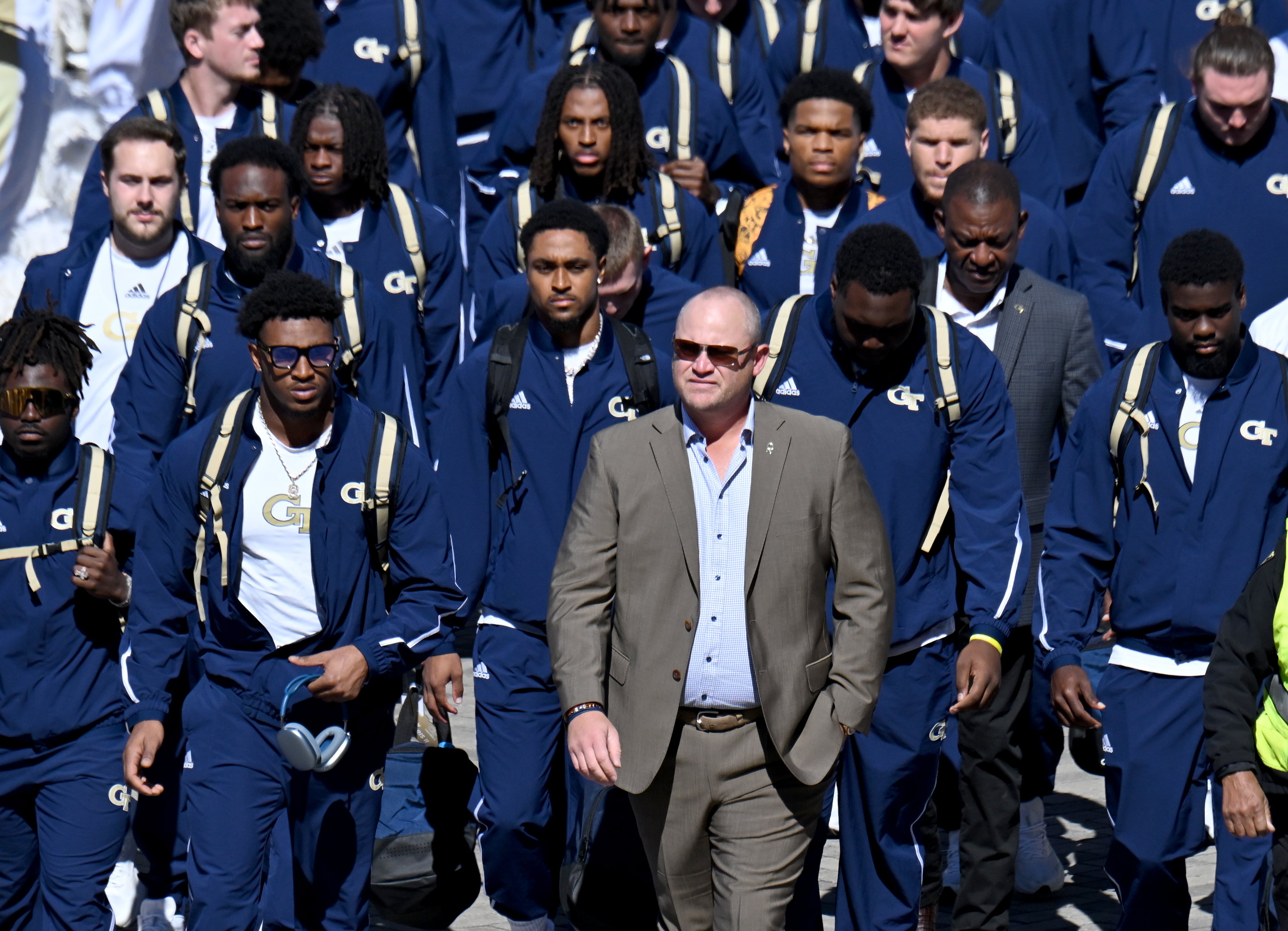 Georgia Tech head coach Brent Key and players arrive before the start of the Georgia Tech football game against Notre Dame at Mercedes-Benz Stadium, Saturday, October 19, 2024, in Atlanta. (Hyosub Shin / AJC)