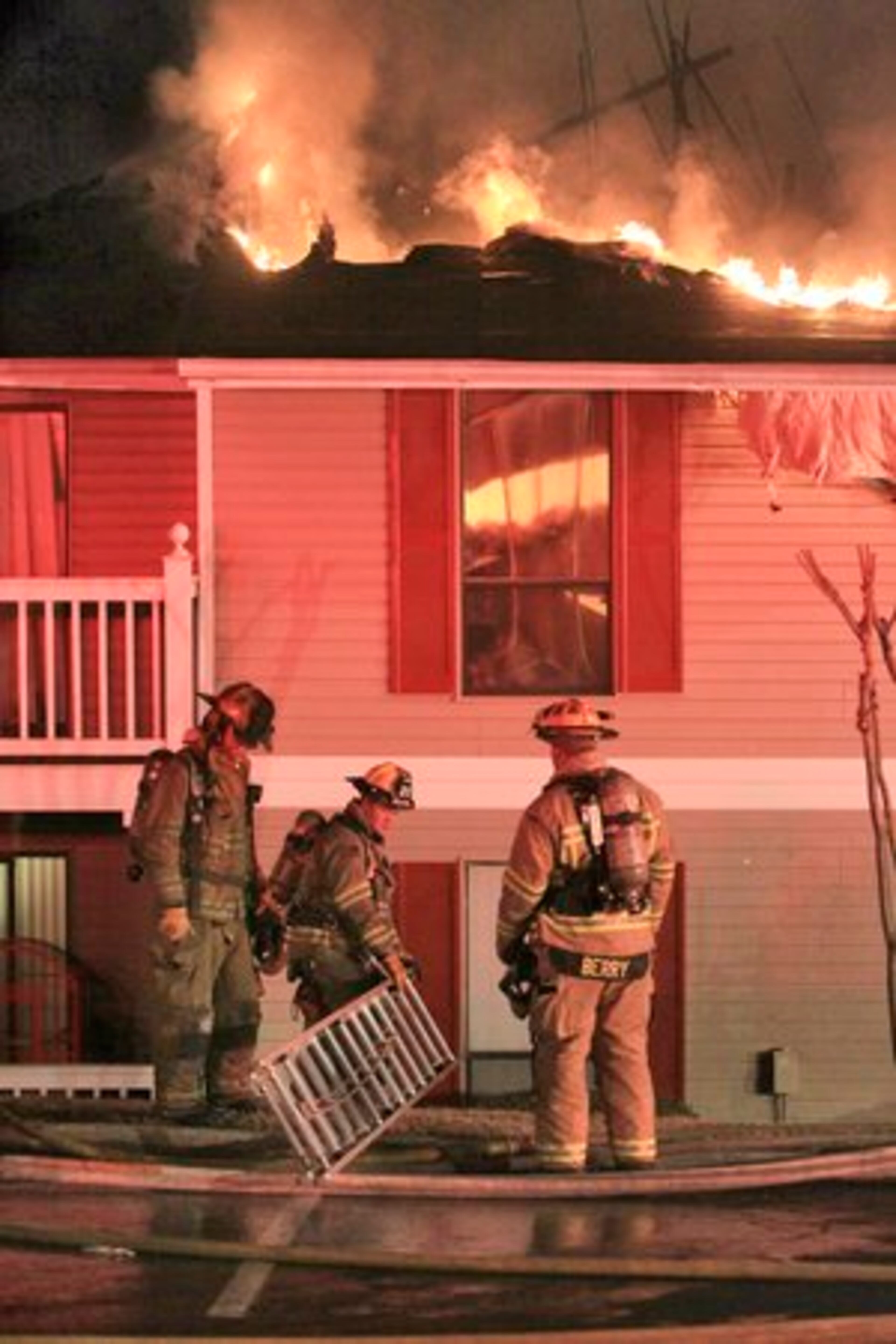 Firefighters prepare to go into the apartments.