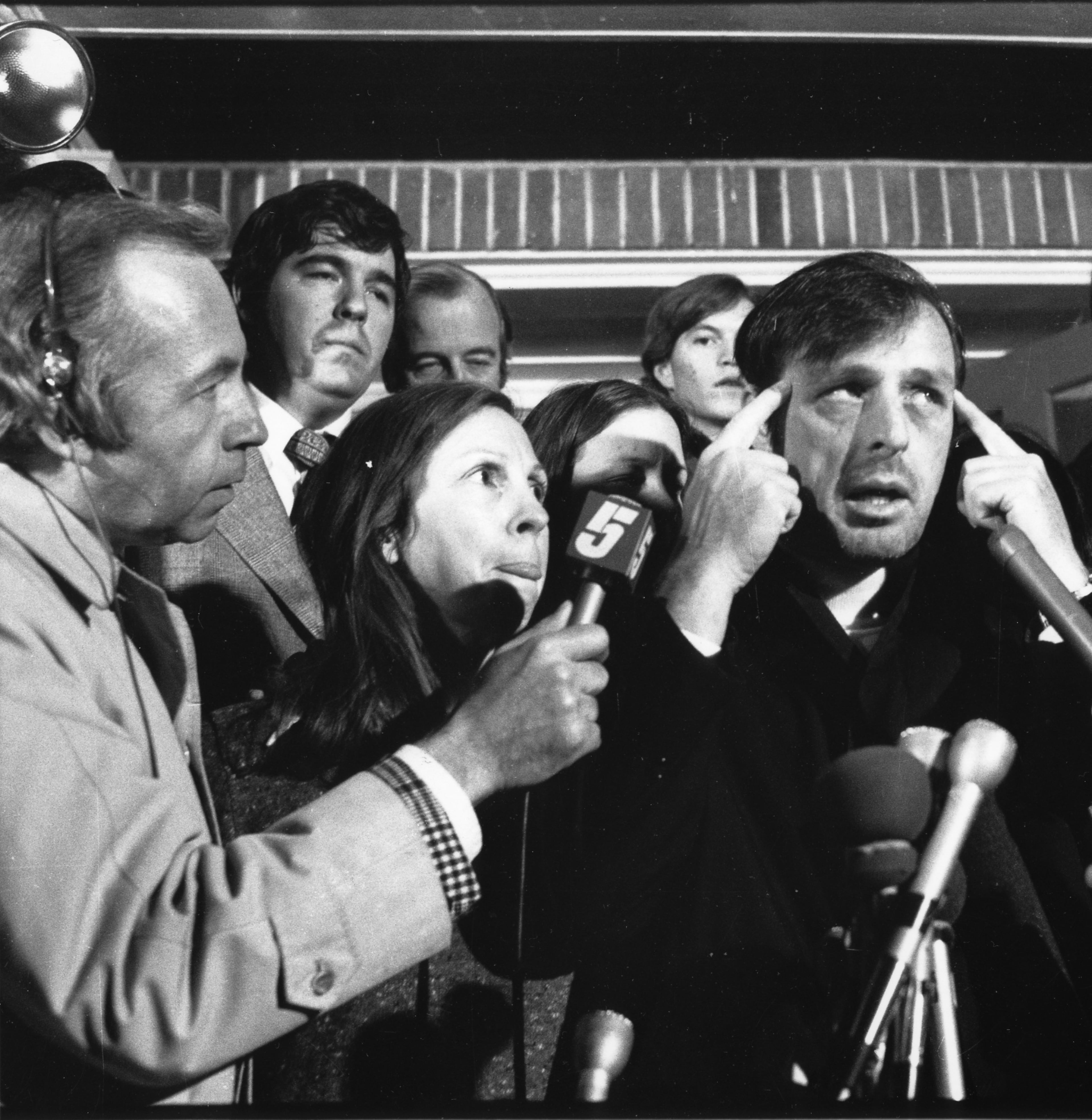 Channel 5 newsman Paul Shields (left) listens as former Atlanta Constitution editor Reg Murphy (right) describes his ordeal after he was kidnapped and held for ransom in February, 1974.