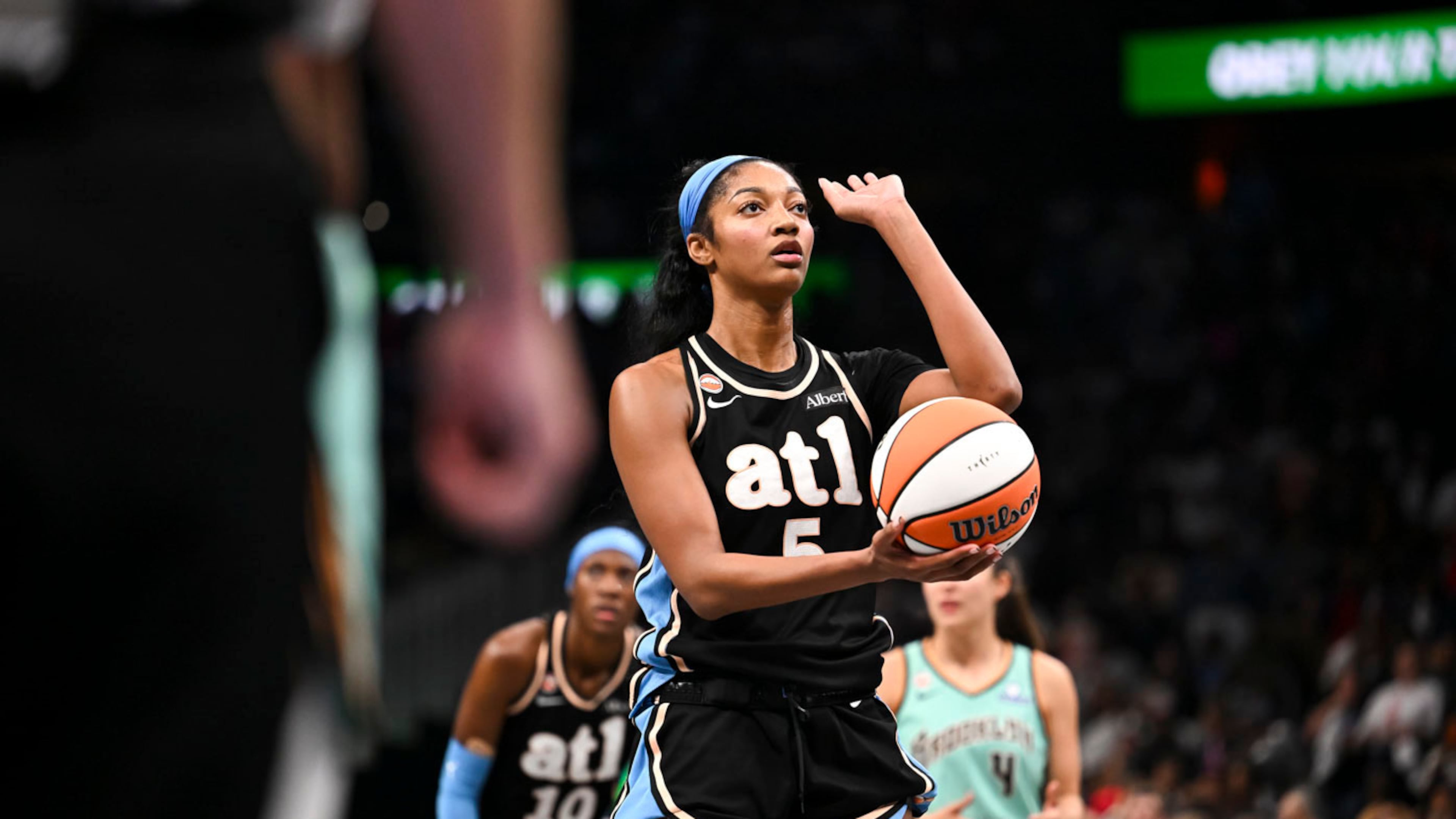 Atlanta Dream forward Angel Reese (5) sets up for a foul shot against New York Liberty during the second half in Game 2 of the WNBA basketball semifinals, Wednesday, Oct. 7, 2026, in Atlanta. (AP Photo/Daniel Varnado)