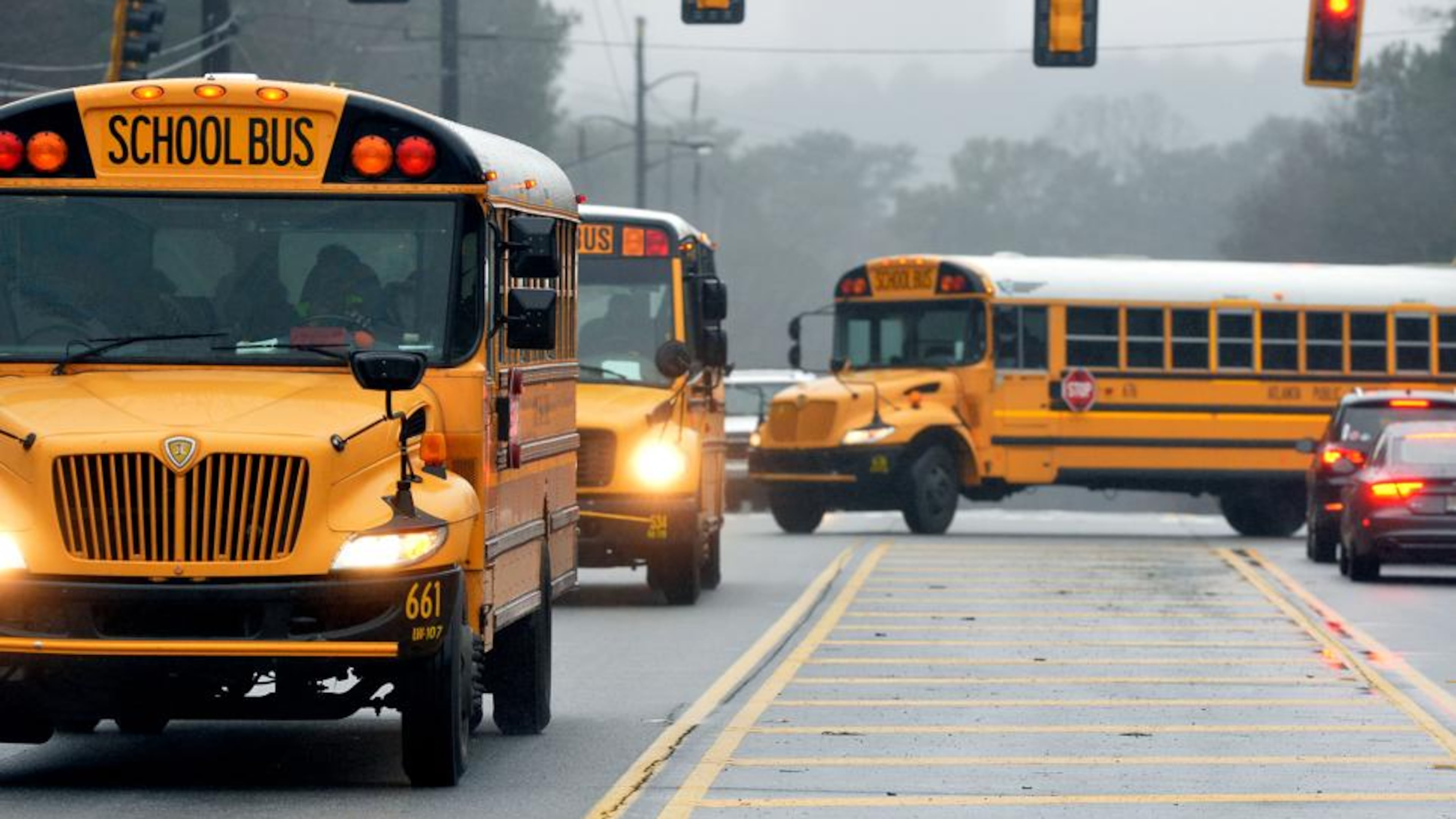 With nearly a dozen school systems starting back on Thursday, the Georgia Department of Transportation urges drivers to exercise caution and maintain a 10-foot buffer around school buses. AJC file photo