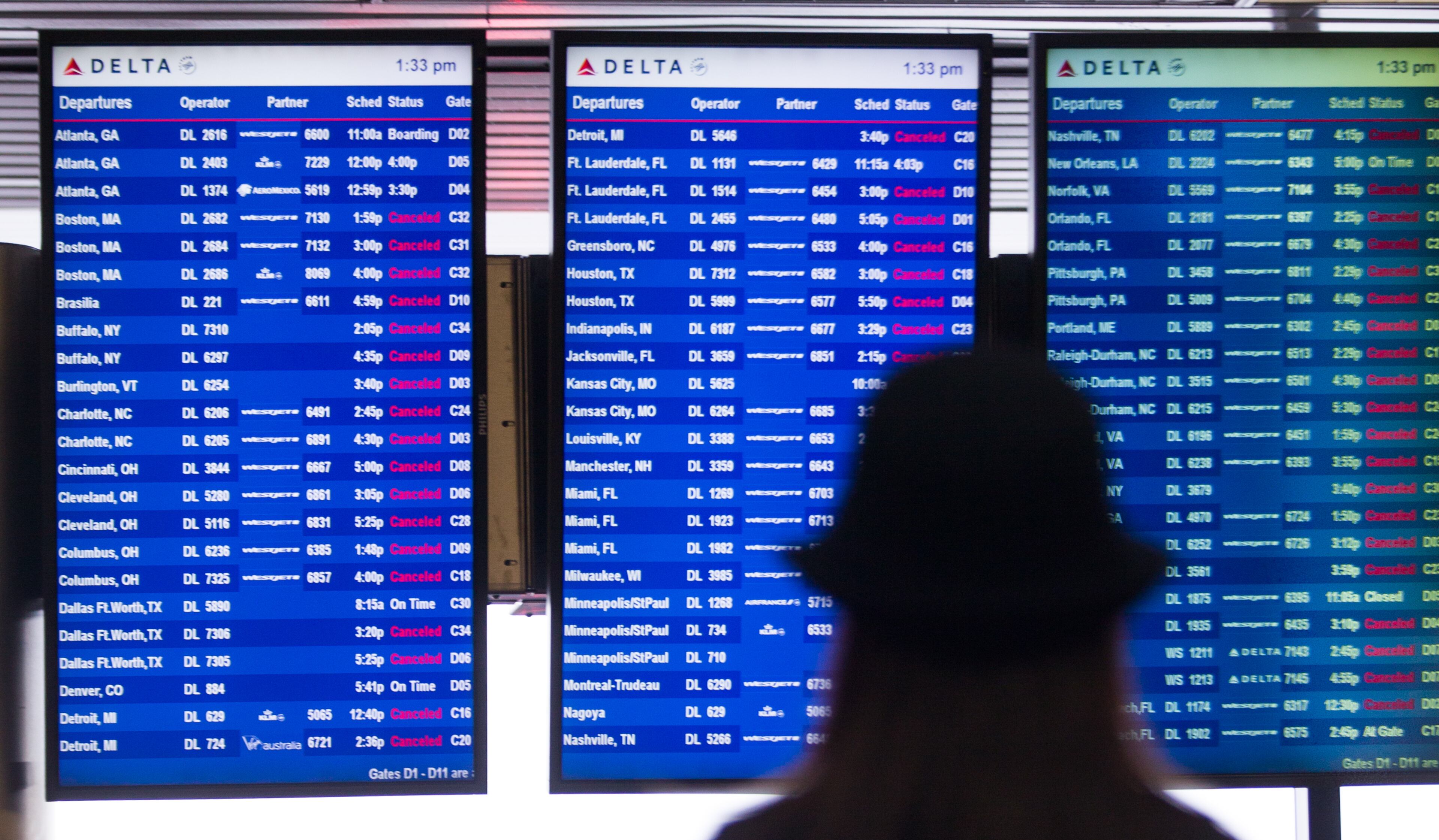 NEW YORK, NY - MARCH 5: Departure boards show cancelled Delta flights March 5, 2015 at LaGuardia Airport in the Queens borough of New York City. A Delta jet partially skidded off a runway at the airport while trying to land in a snowstorm. (Photo by Andrew Theodorakis/Getty Images).