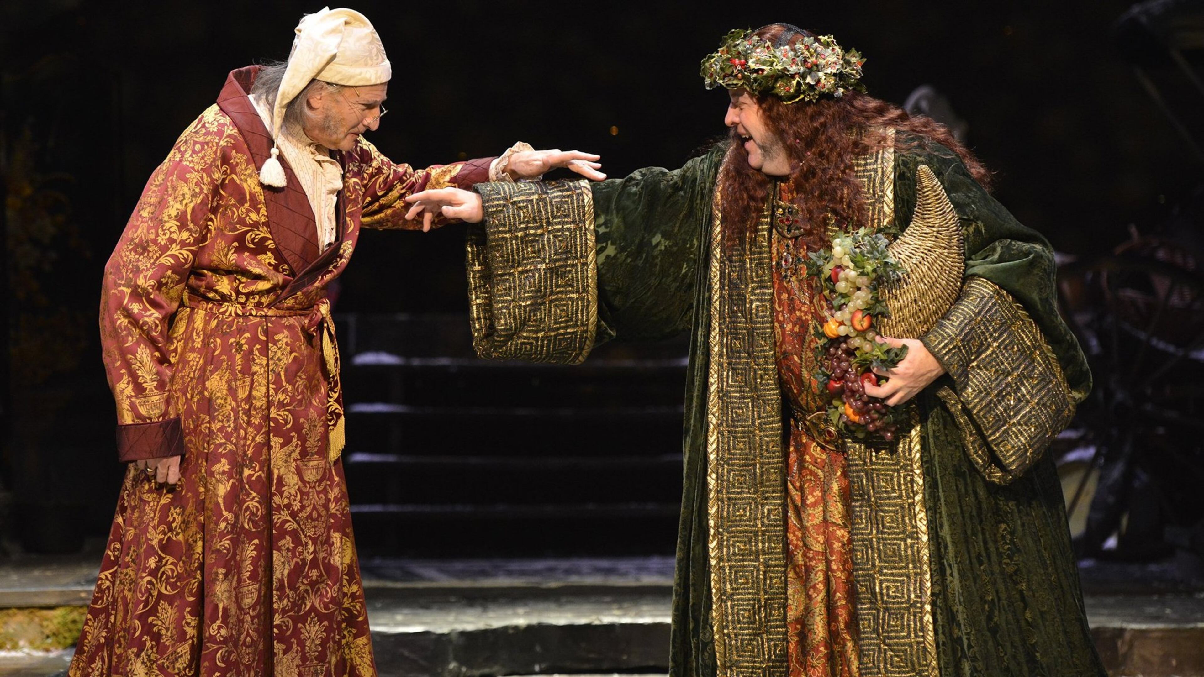 David De Vries (left) and Bart Hansard reprise their roles as Ebenezer Scrooge and the Ghost of Christmas Present in “A Christmas Carol”at the Alliance Theatre. PHOTO CREDIT: Greg Mooney