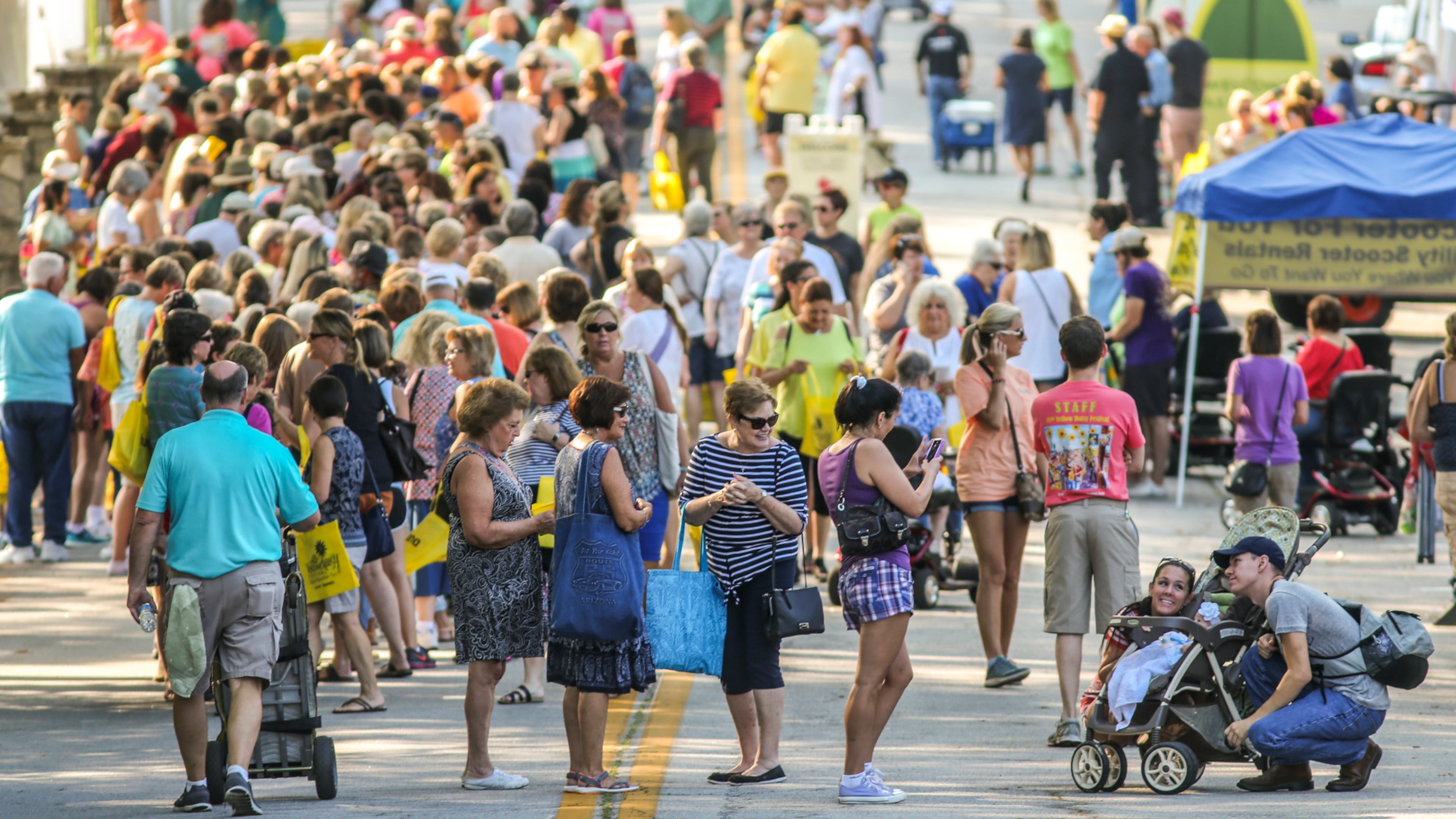 September 8, 2016 Stone Mountain: The Stone Mountain Park 48th Annual Yellow Daisy Festival got underway Thursday, Sept. 8, 2016 as more than 425 artists will be featured to an estimated 200,000 shoppers over this weekend. The festival opens 10 a.m. to 6 p.m. Friday, 10 a.m. to 7:30 p.m. Saturday, and Sunday 10 a.m. to 5 p.m. The annual festival is celebrated in September during the blooming of a special Yellow Daisy which only grows within 60 miles of Stone Mountain. In 1846, Viguiera Porteri was discovered growing on the granite outcroppings of the mountain. The Yellow Daisy Festival jury selects festival crafters and artists to display their handmade work including pottery, fabric, painting, jewelry, sculpture, fiber, photography, fine arts and traditional arts and crafts. JOHN SPINK /JSPINK@AJC.COM