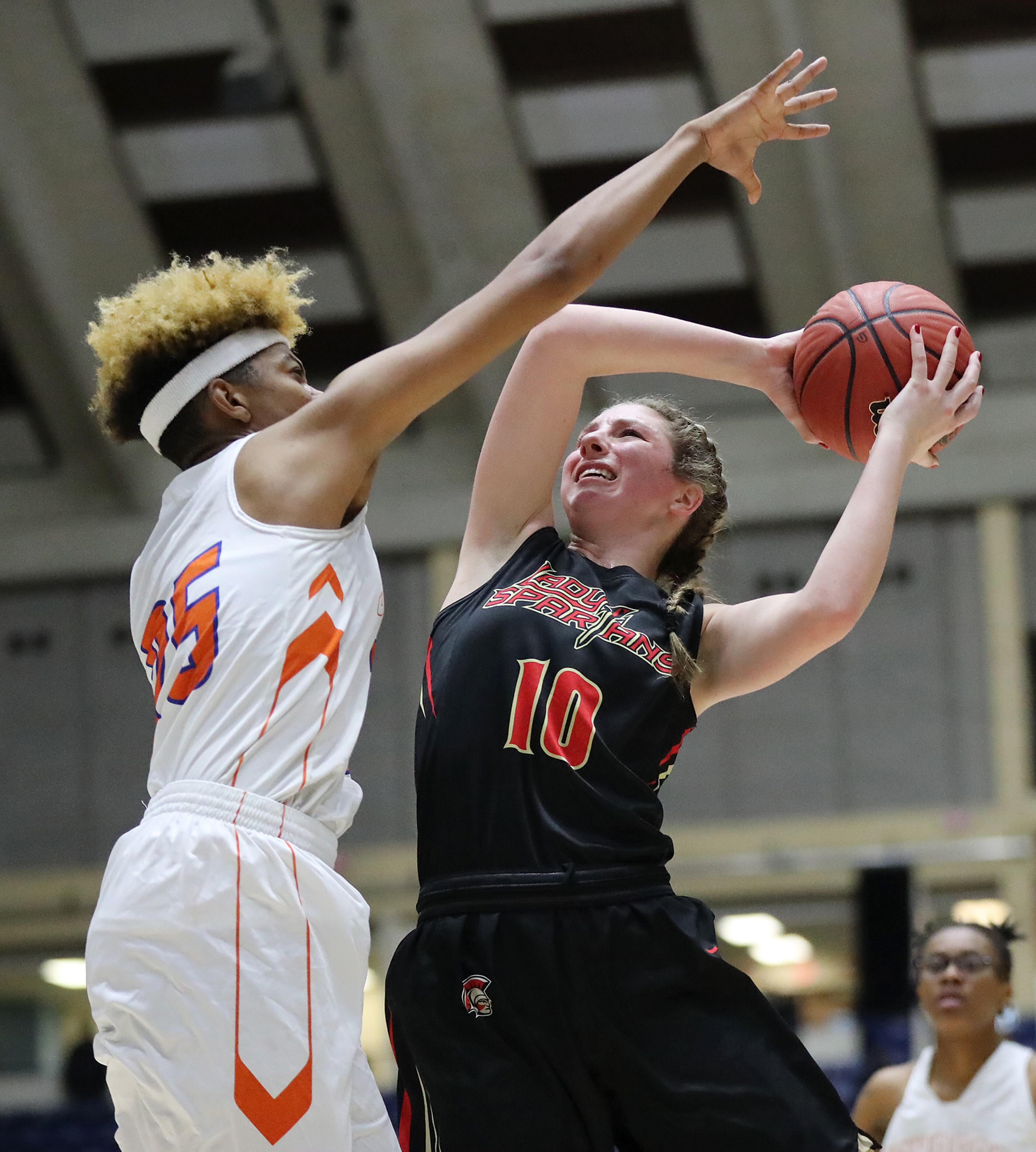 March 8, 2018 Macon: GAC center MaryMartha Turner has a shot blocked by Johnson-Savannah center Giana Copeland in their GHSA state basketball championship game on Thursday, March 8, 2018, in Macon. Curtis Compton/ccompton@ajc.com