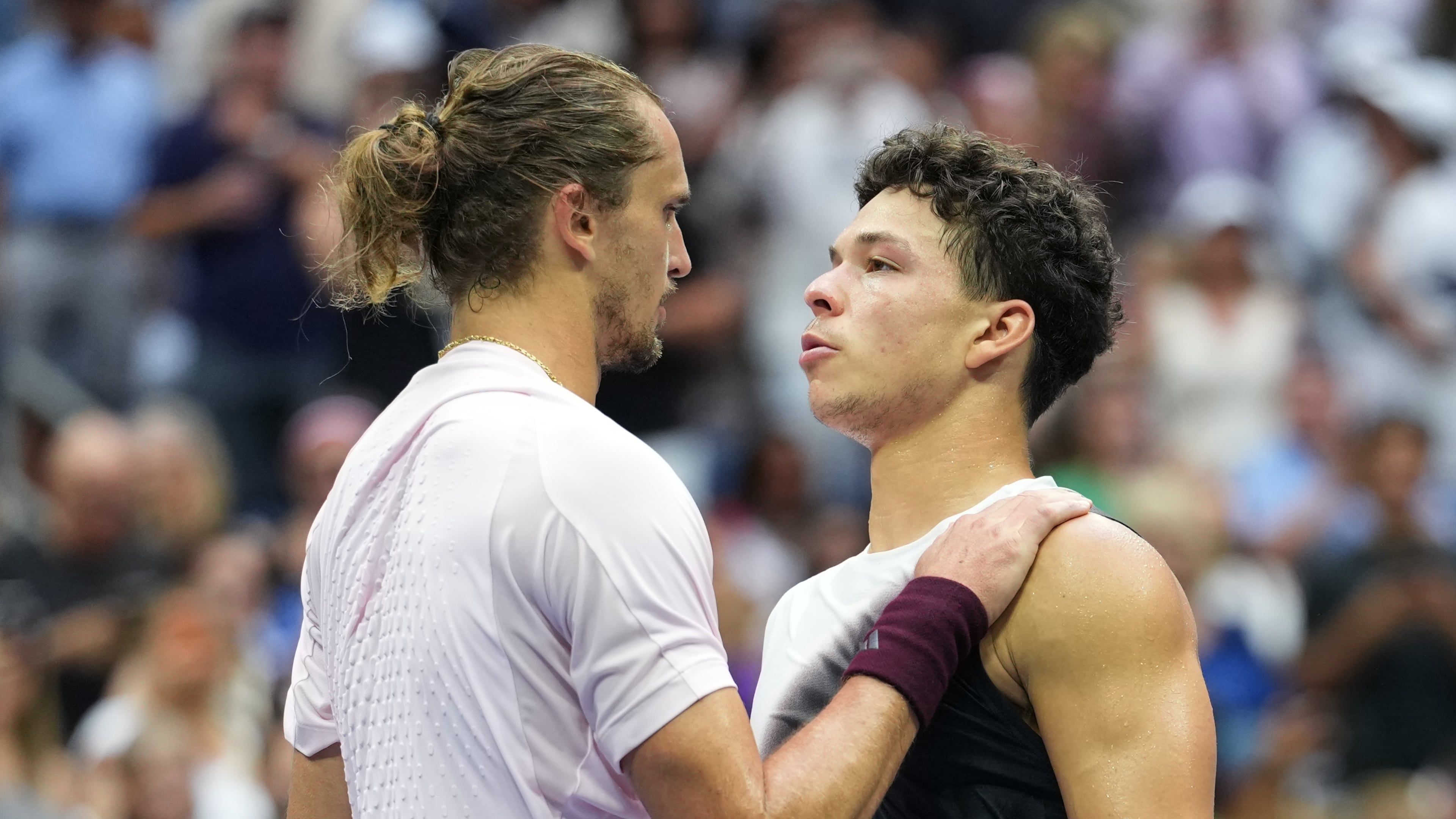 Alexander Zverev, of Germany, left, greets Ben Shelton, of the United States, after Zverev won the men's singles final of the U.S. Open tennis championships Sunday, Sept. 13, 2026, in New York. (AP Photo/Kirsty Wigglesworth)