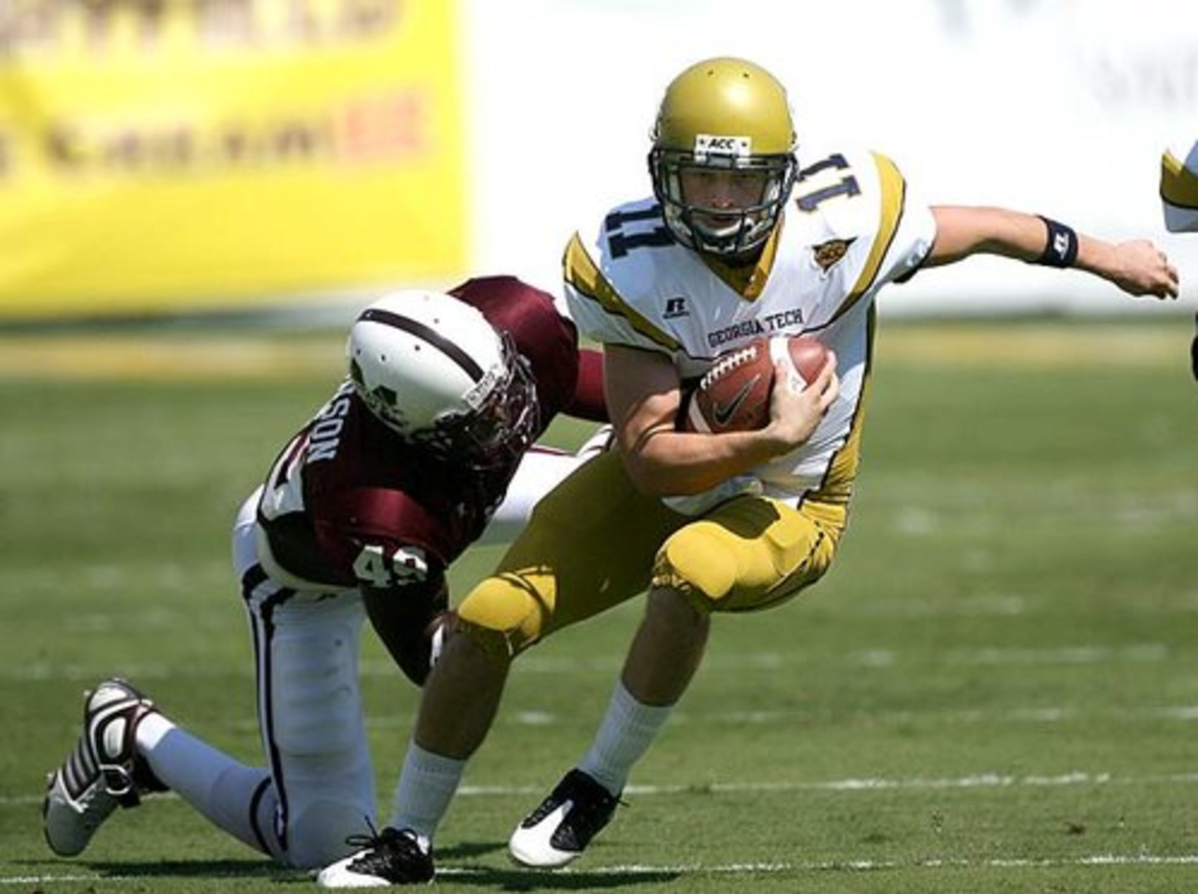 Georgia Tech's Jaybo Shaw breaks a tackle by Mississippi State's Terrell Johnson in the first quarter.