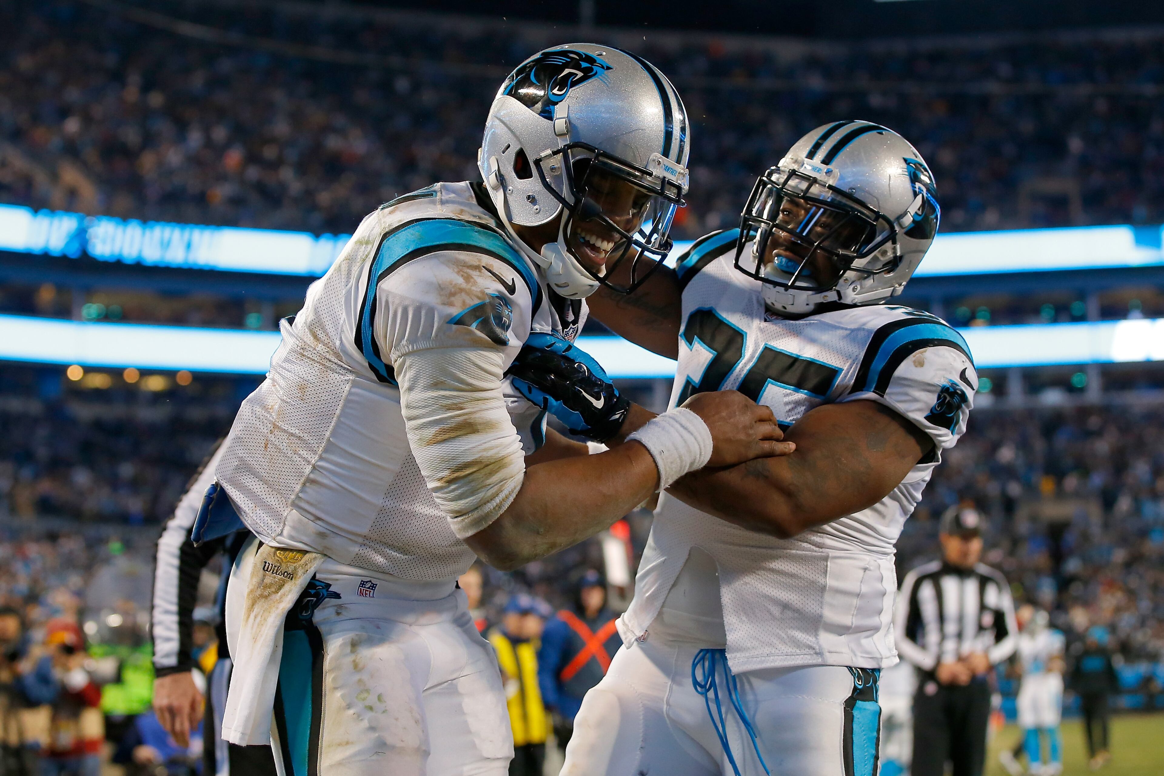 CHARLOTTE, NC - JANUARY 24: Cam Newton #1 of the Carolina Panthers celebrates with Mike Tolbert #35 after scoring a touchdown in the third quarter against the Arizona Cardinals during the NFC Championship Game at Bank of America Stadium on January 24, 2016 in Charlotte, North Carolina. (Photo by Kevin C. Cox/Getty Images)