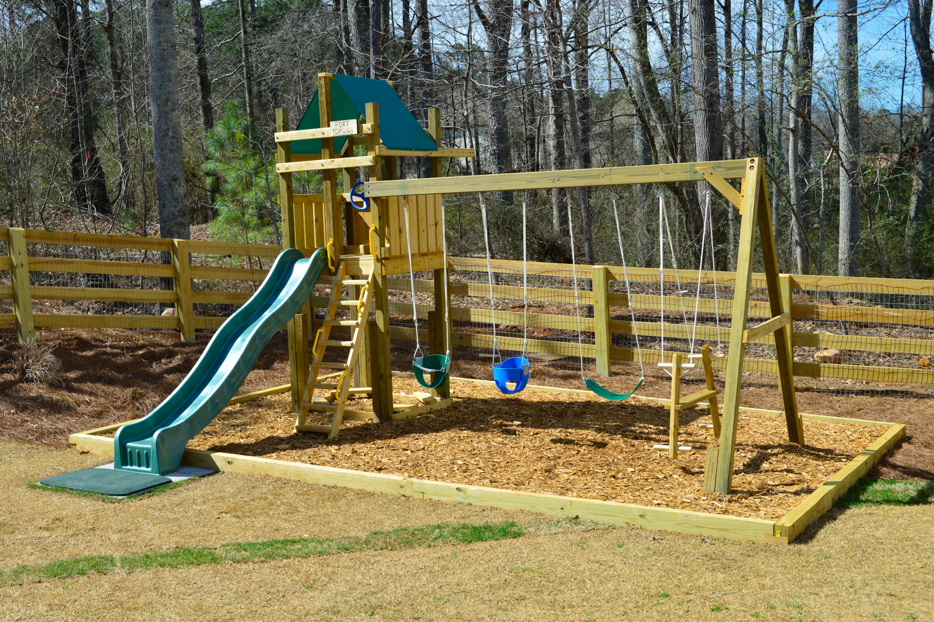 Justin and Sophia DeCouto added a playset from King of Swings in Norcross to the backyard of their new home in Milton's Lake Haven of Crabapple neighborhood. A fence also was installed.