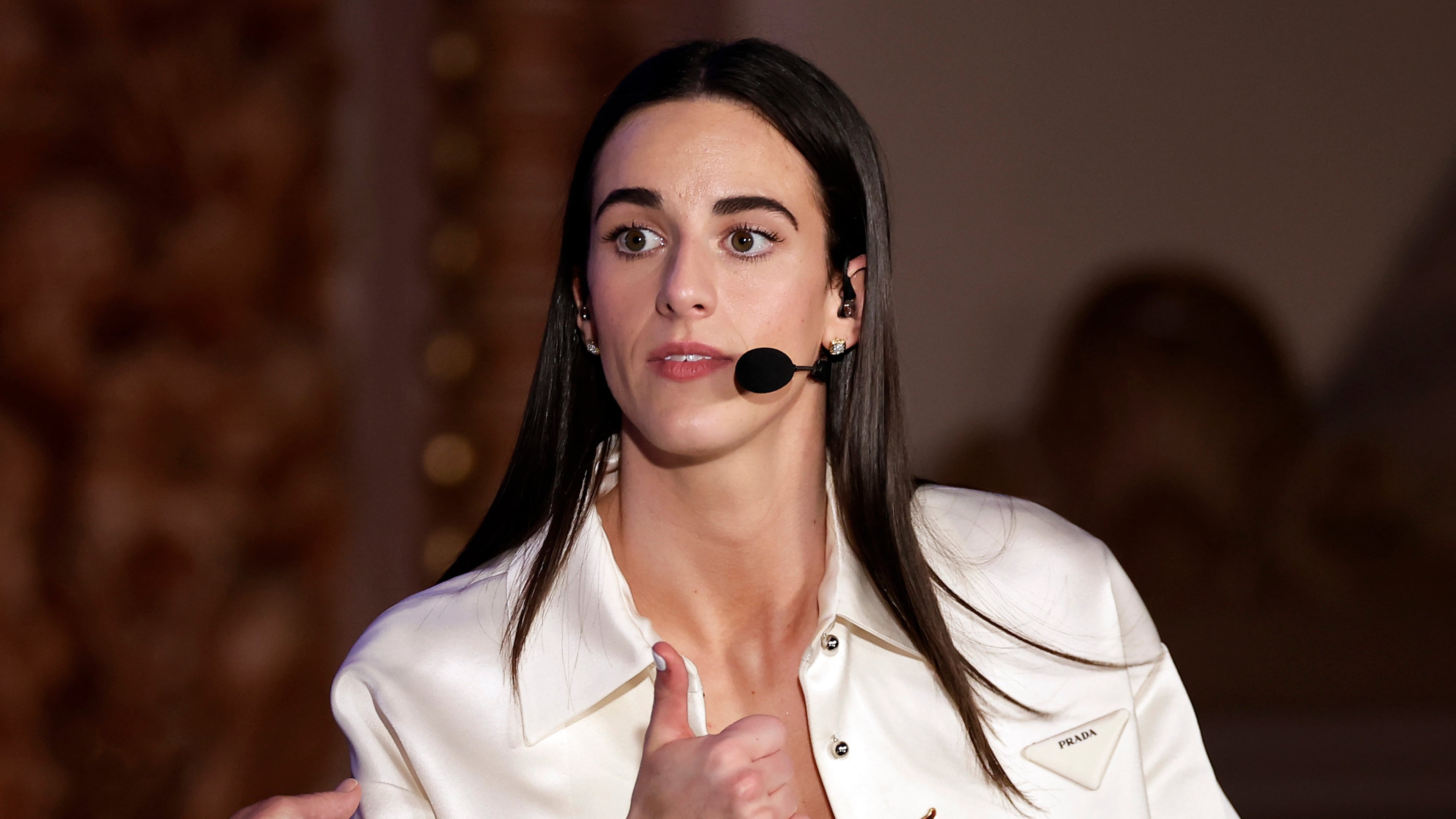 FILE - Indiana Fever's Caitlin Clark reacts during an interview during the WNBA basketball draft, April 15, 2024, in New York. (AP Photo/Adam Hunger, File)