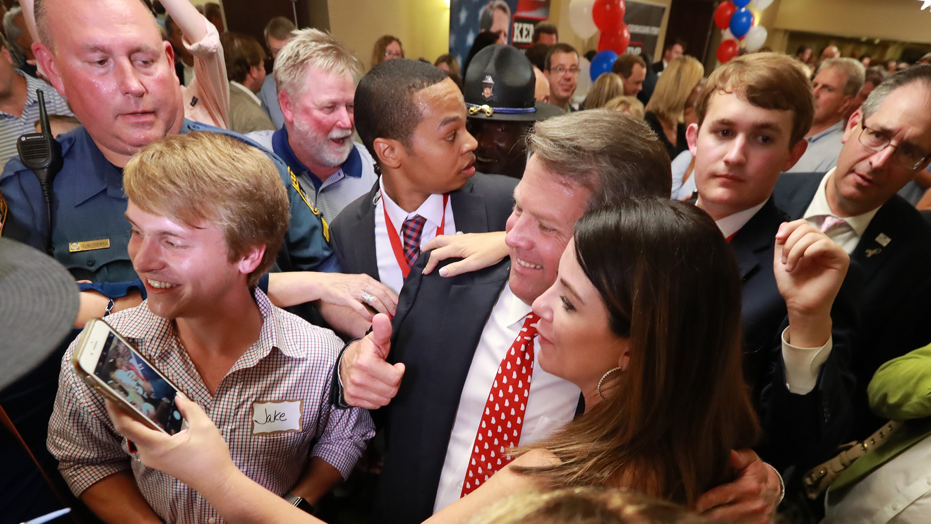 Brian Kemp, now the Republican nominee for governor, pauses for a selfie with a supporter (and the actor who played “Jake” in his TV ads) after his victory speech on Tuesday in Athens. Curtis Compton,ccompton@ajc.com