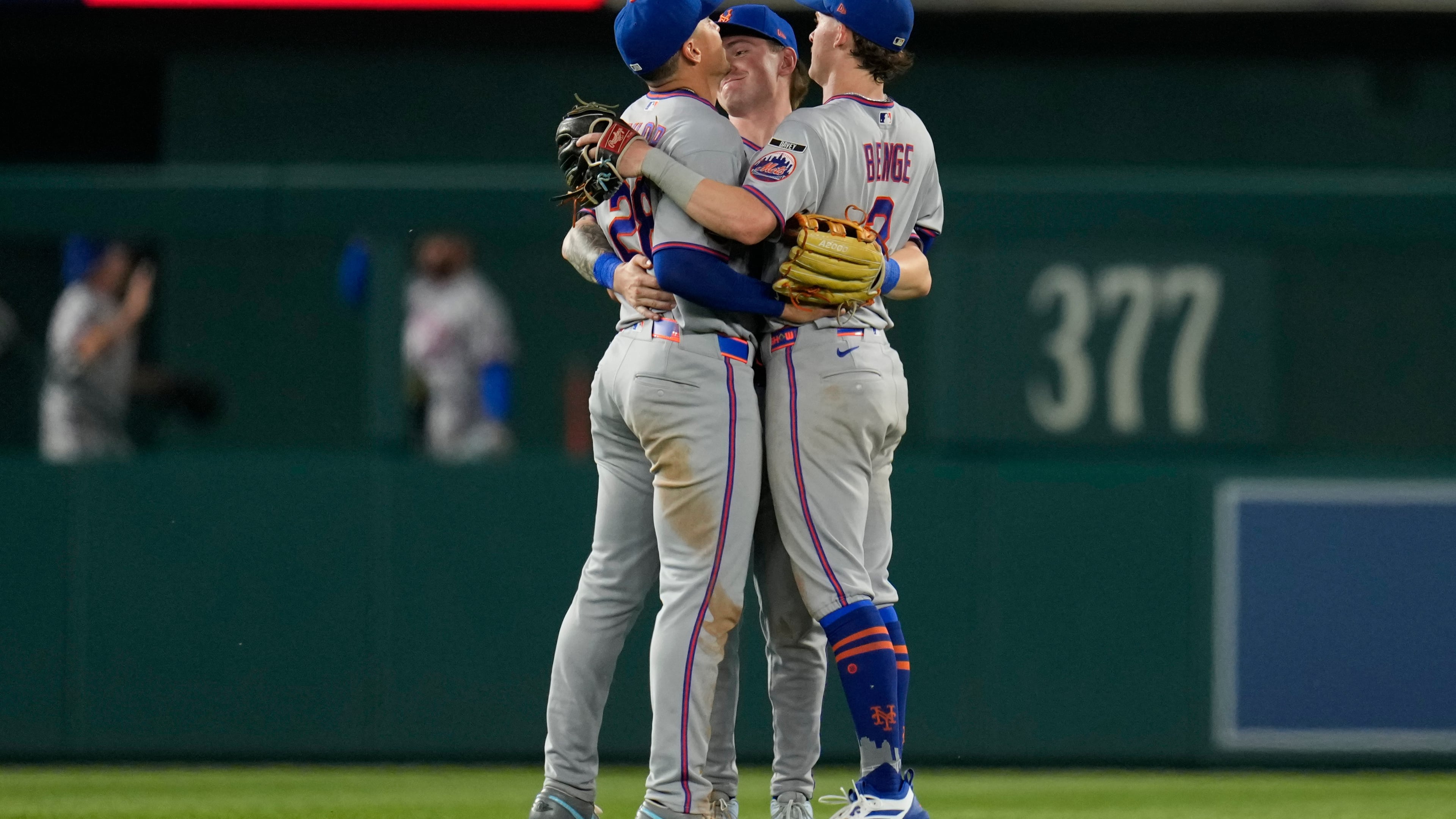 From left to right, New York Mets left fielder Tyrone Taylor, center fielder A.J. Ewing, and right fielder Carson Benge celebrate after winning a baseball game against the Washington Nationals, Monday, May 18, 2026, in Washington. (AP Photo/Jess Rapfogel)