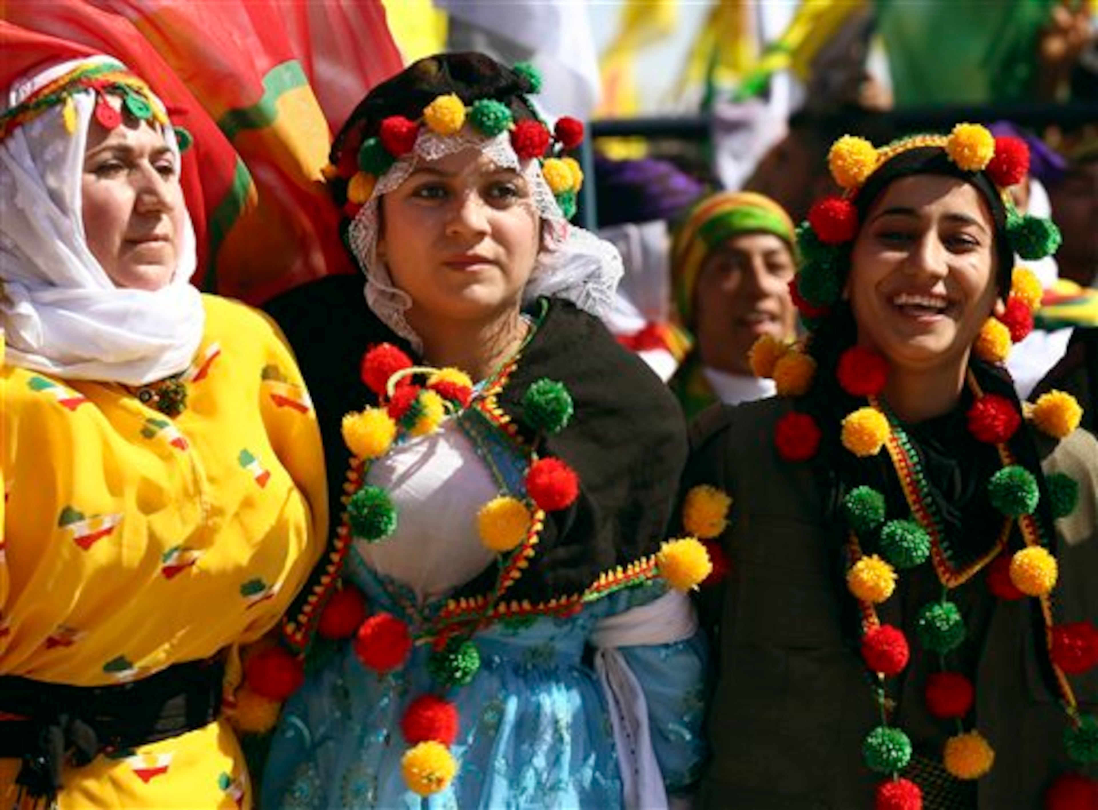 Kurdish women, recat, during the Nowruz celebrations in southeastern Turkish city of Diyarbakir, Turkey, Friday, March 21, 2014. Nowruz, the Farsi-language word for "new year", is an ancient Persian festival, celebrated on the first day of spring, March 21, in Central Asian republics, Iraq, Turkey, Afghanistan and Iran. (AP Photo)