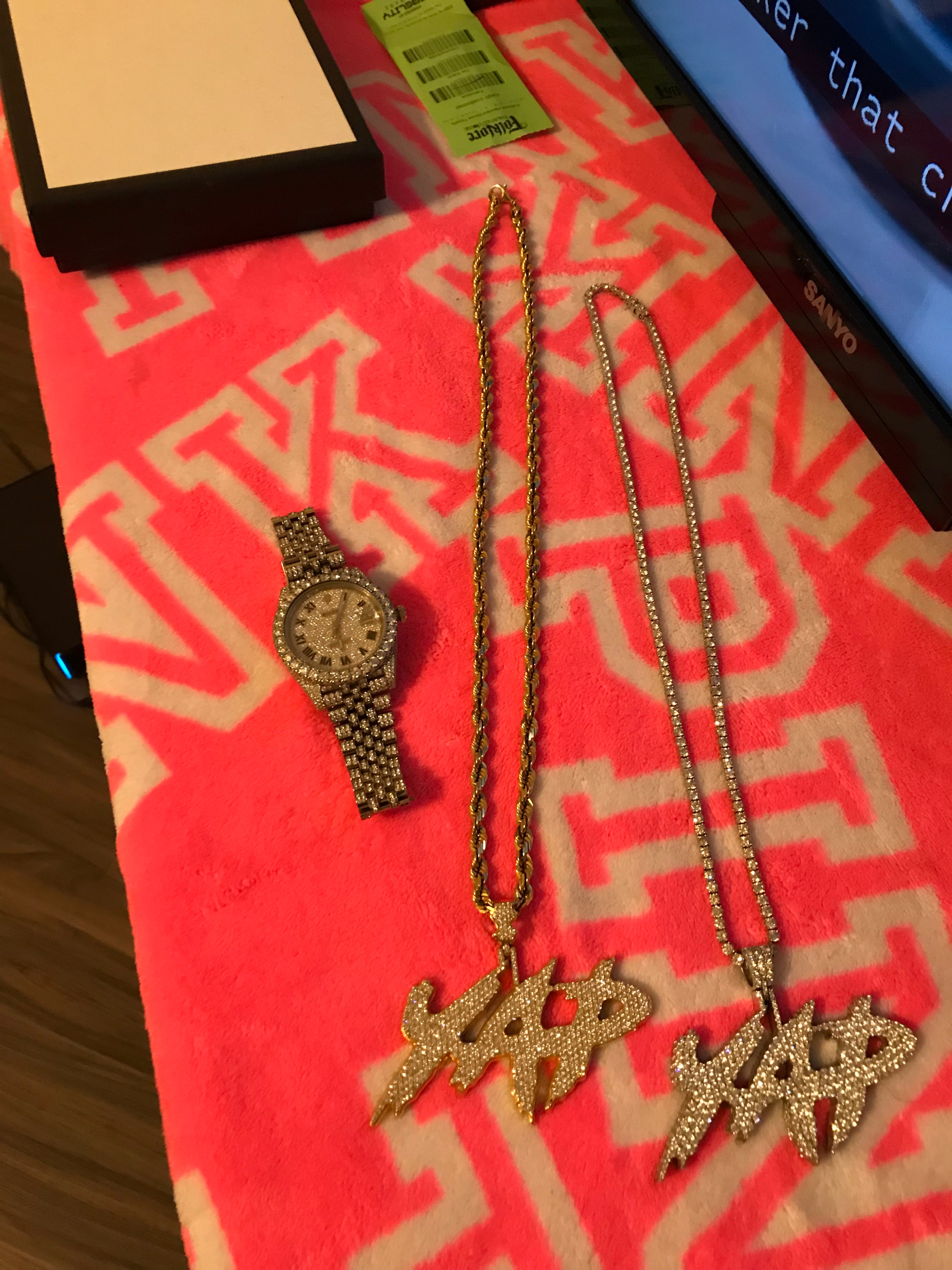 Jewelry seized by police from associates of Arthur Cofield have the initials YAP, short for Young and Paid. Cofield founded the crew while serving 14 years in Georgia prisons, but his influence was felt far outside the prison walls. (Courtesy of the Fulton County District Attorney's Office)