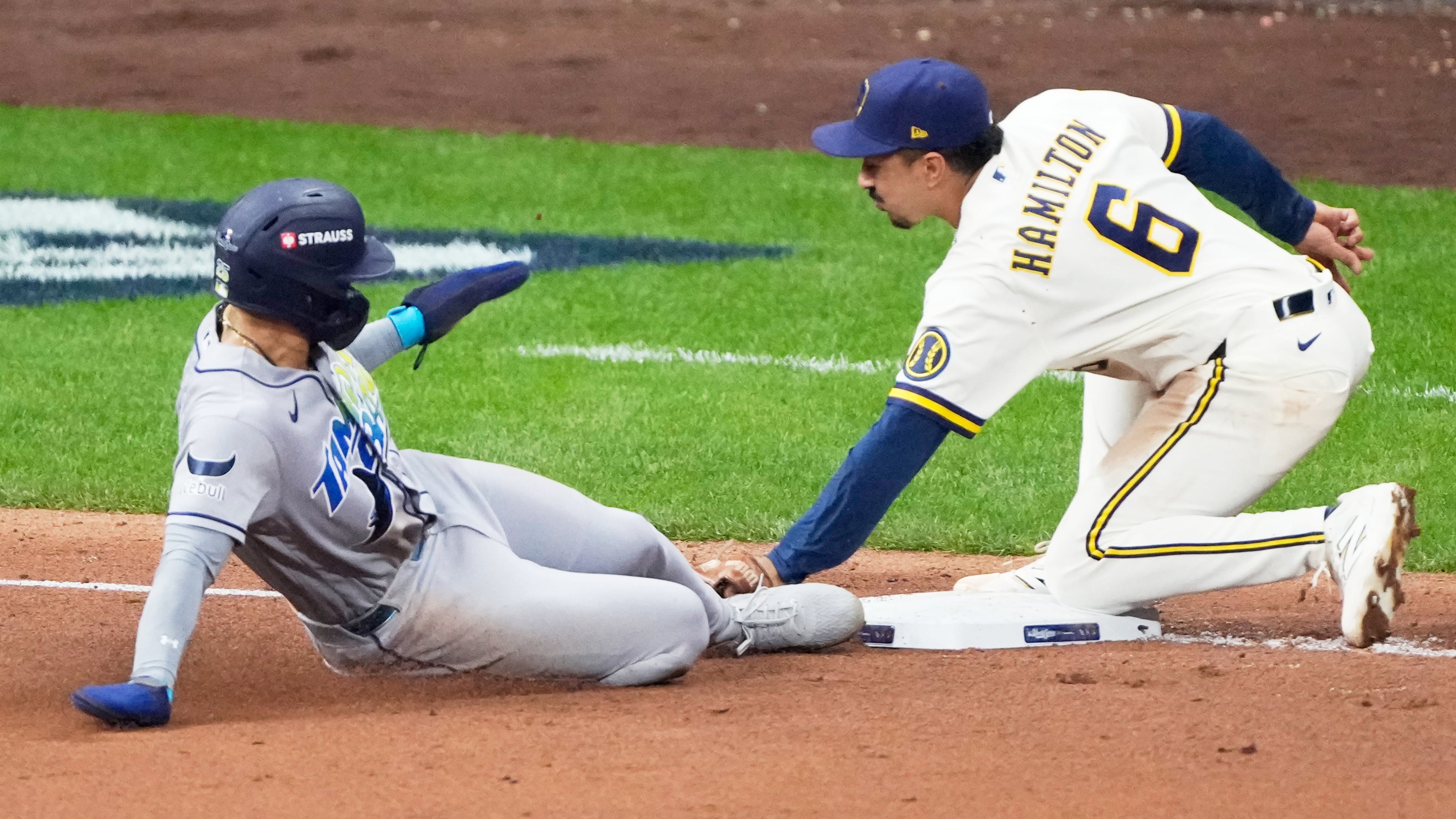 Tampa Bay Rays' Victor Mesa Jr. is tagged out stealing by Milwaukee Brewers third baseman David Hamilton during the fifth inning of Game 1 of baseball's World Series, Friday, Oct. 23, 2026, in Milwaukee, between the Milwaukee Brewers and the Tampa Bay Rays. (AP Photo/David J. Phillip)