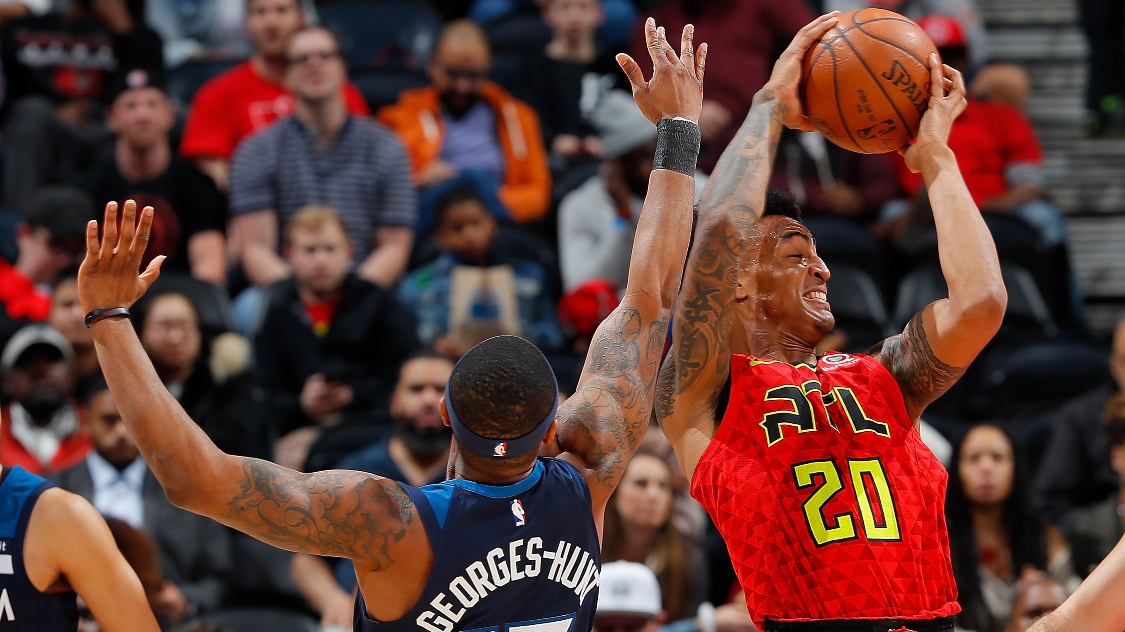 ATLANTA, GA - JANUARY 29: Marcus Georges-Hunt #13 of the Minnesota Timberwolves attempts a steal against John Collins #20 of the Atlanta Hawks at Philips Arena on January 29, 2018 in Atlanta, Georgia. NOTE TO USER: User expressly acknowledges and agrees that, by downloading and or using this photograph, User is consenting to the terms and conditions of the Getty Images License Agreement. (Photo by Kevin C. Cox/Getty Images)