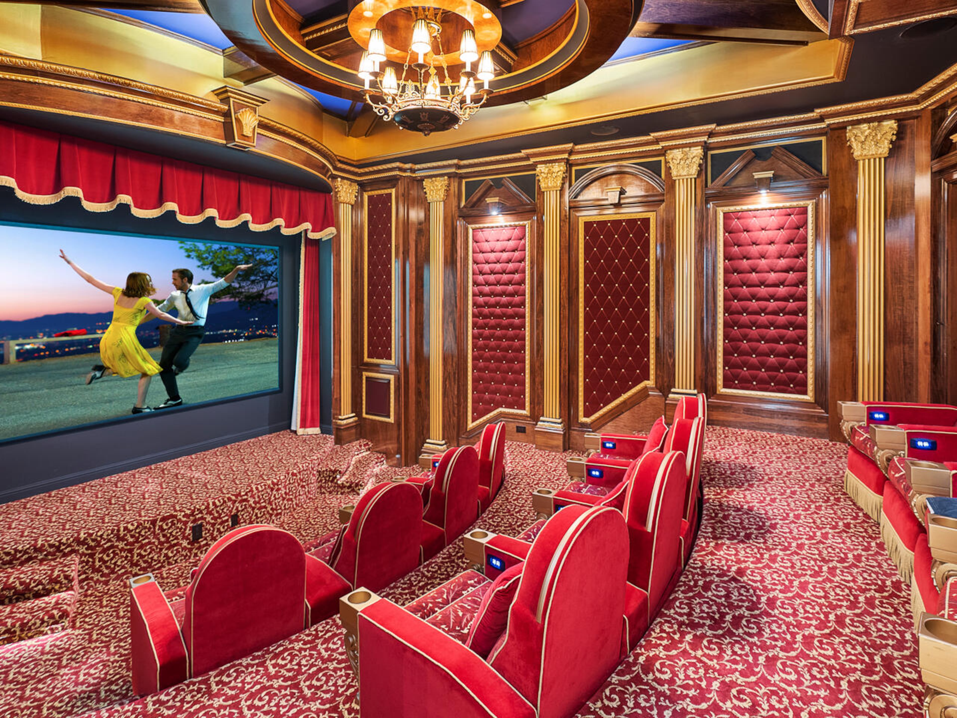 The 12-seat movie theater is incredible. You will feel like you are at the Fox Theatre with details that include gold accented walls, a chandelier, padded walls and stage with a large projection screen. Text by Elizabeth Manderson and Julie Pedersen/Photo by Ilya Zobanov, Gold Lens Media.