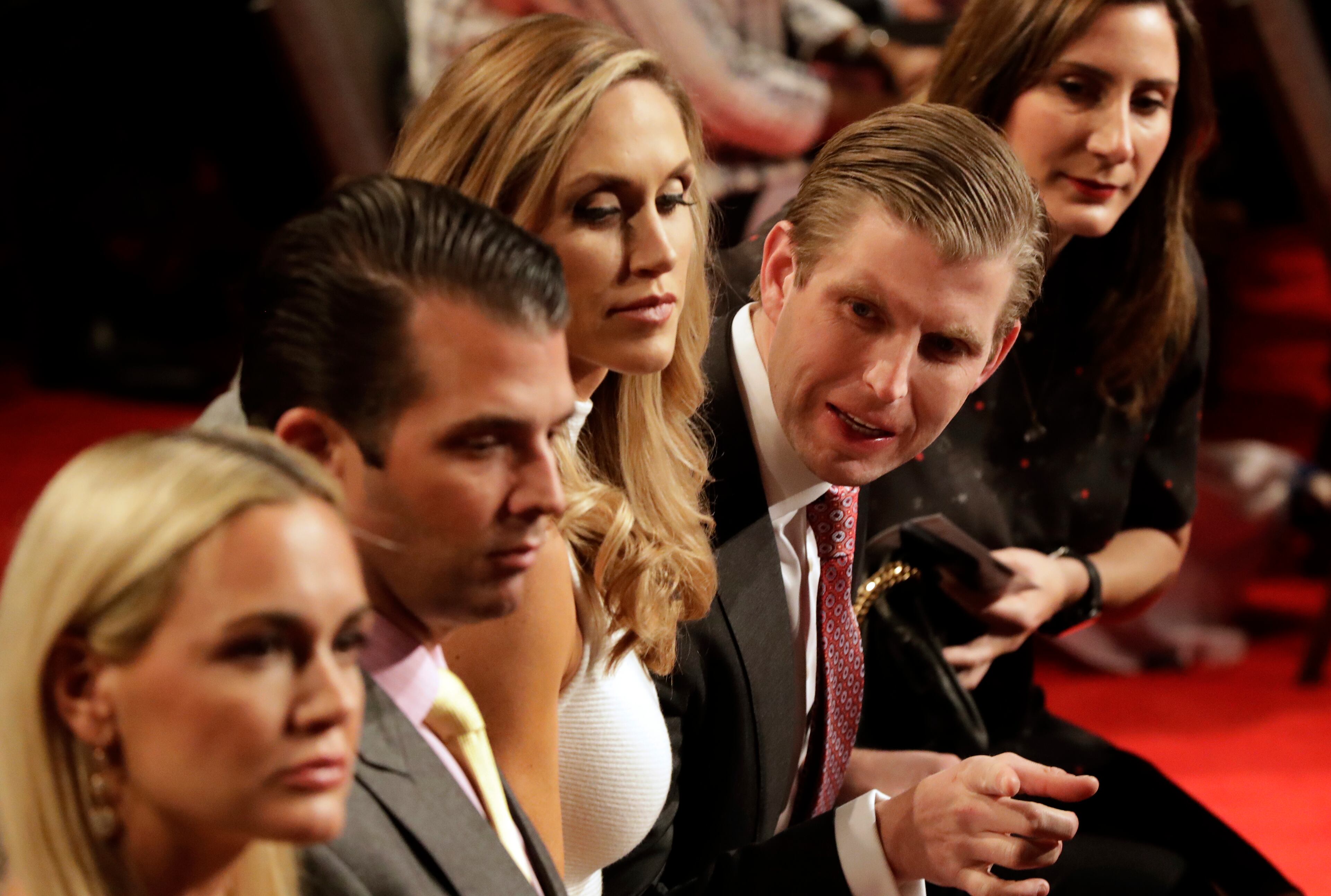Donald Trump's sons Eric, right, and Donald Jr. wait for the third debate between Democratic presidential nominee Hillary Clinton and Republican presidential nominee Donald Trump during the third presidential at UNLV in Las Vegas, Wednesday, Oct. 19, 2016. (AP Photo/David Goldman)